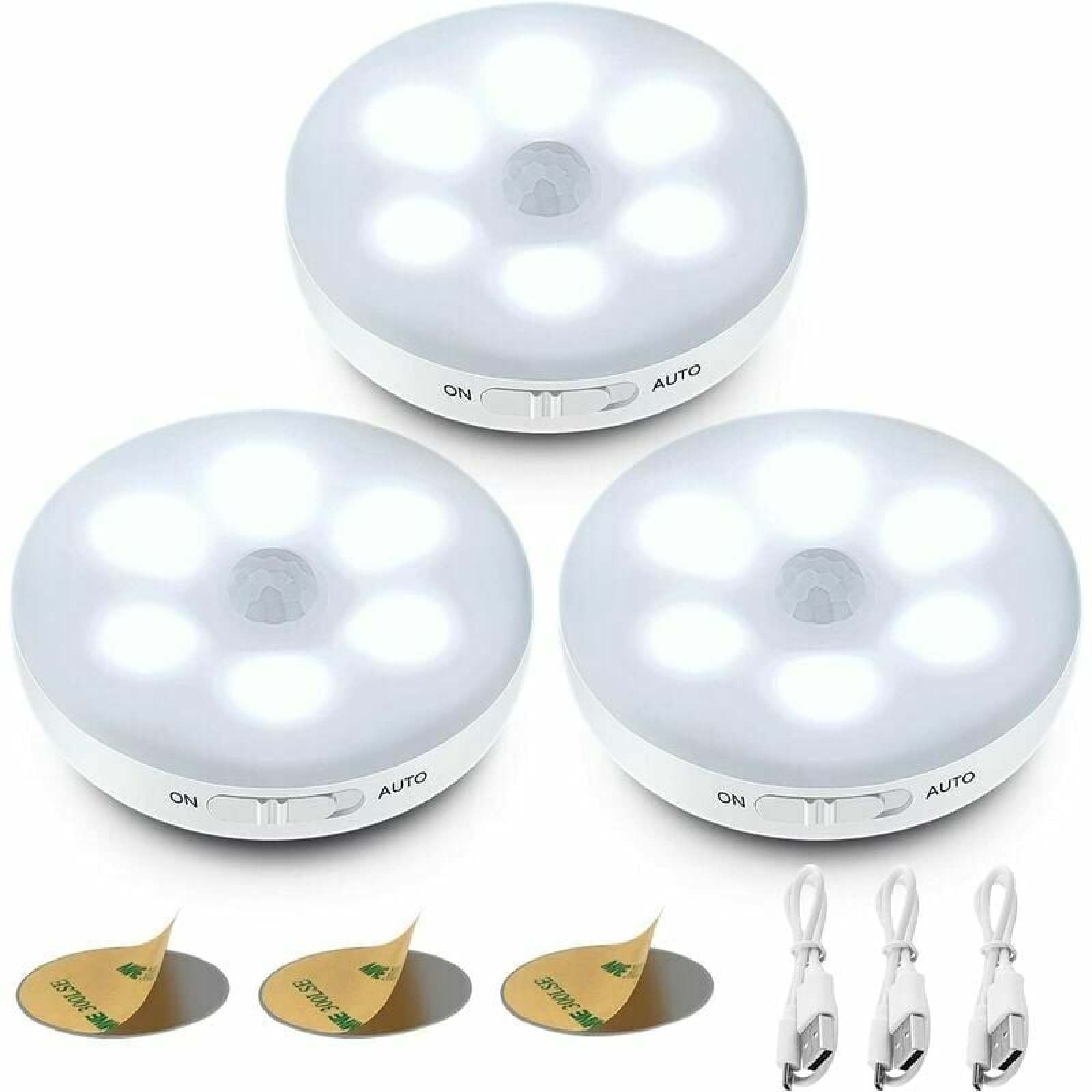 Drei runde weiße LED-Bewegungssensoren mit Klebepads und USB-Kabeln.