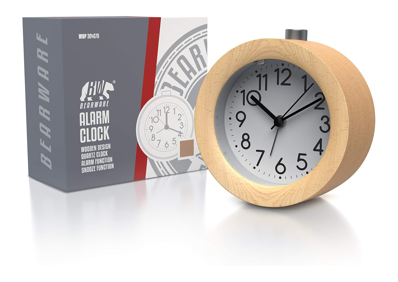 Ein runder Holzwecker mit weißem Zifferblatt und schwarzen Zeigern steht neben seiner Verpackung.