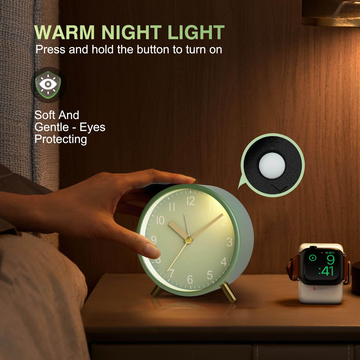 Grüne Nachttischlampe mit Zeigern und ein Smartwatch-Ladegerät.