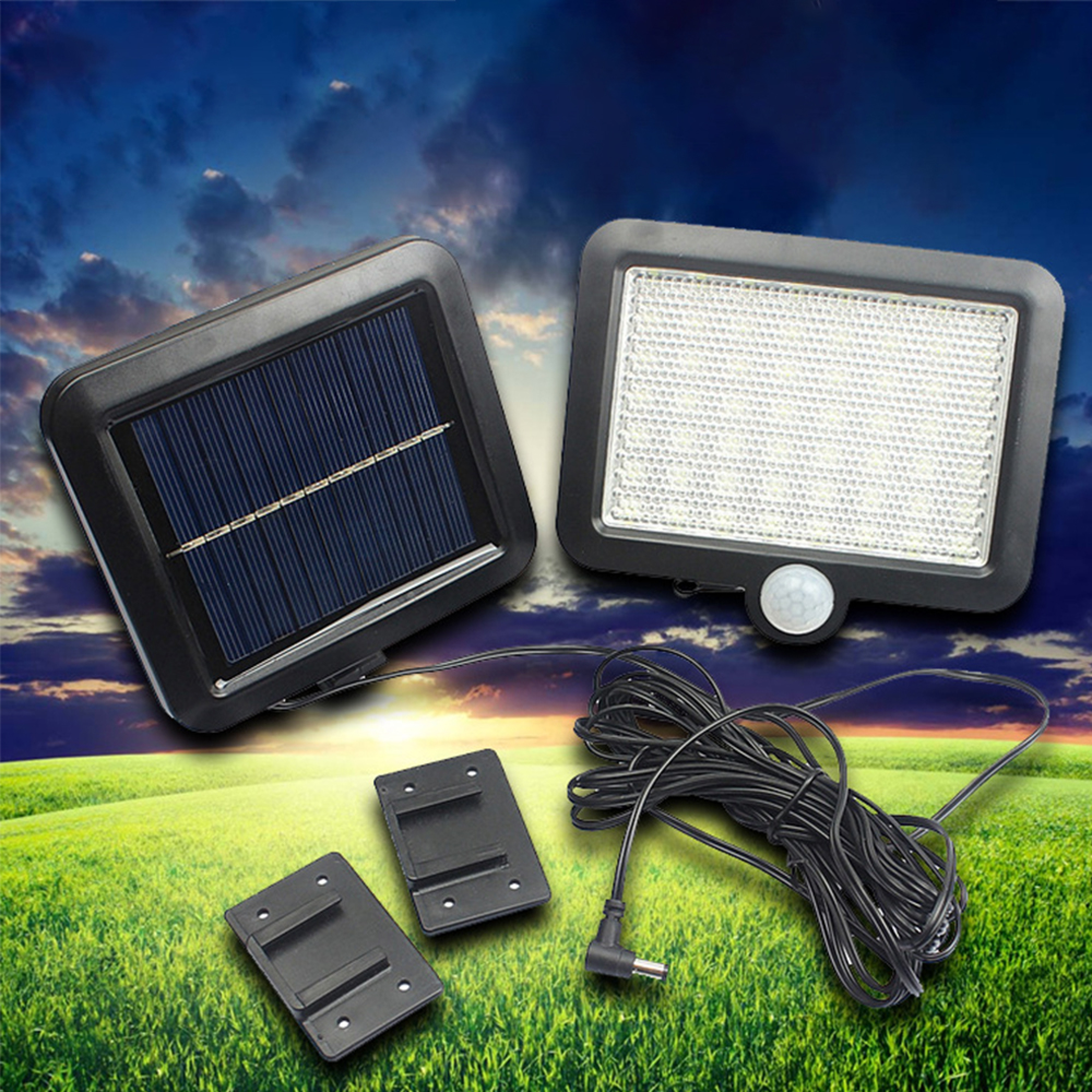Solarleuchte mit Solarpanel, Kabel und Halterungen auf grünem Feld.