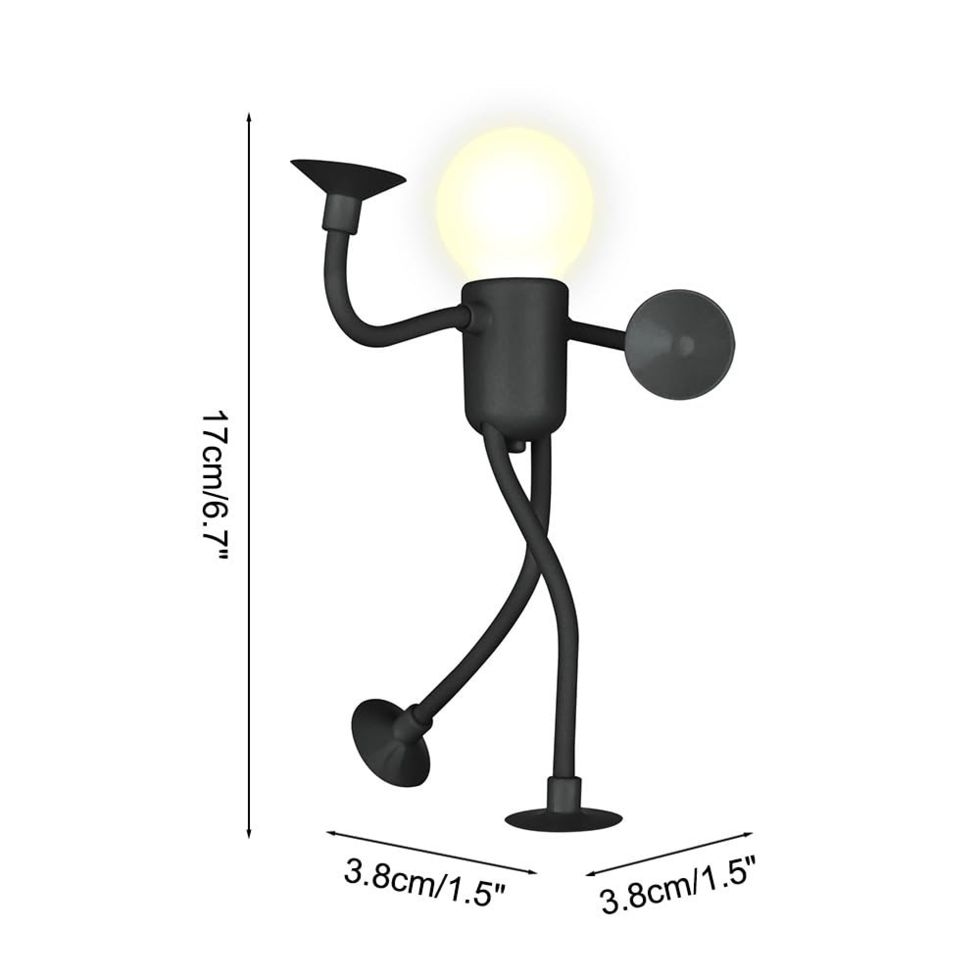 Ein schwarzer Schreibtischlampen-Roboter mit gelbem Licht. Maße: 17cm H.