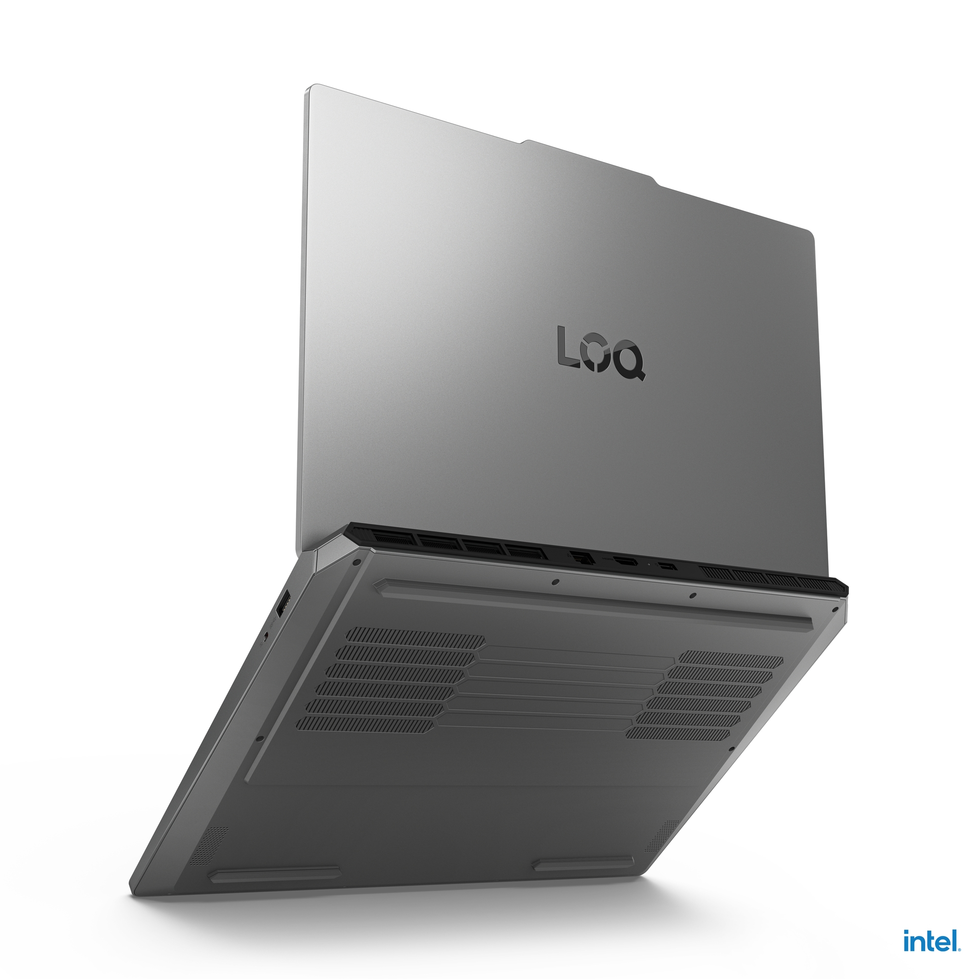 Laptop grigio con coperchio aperto, mostra il lato inferiore e le porte.