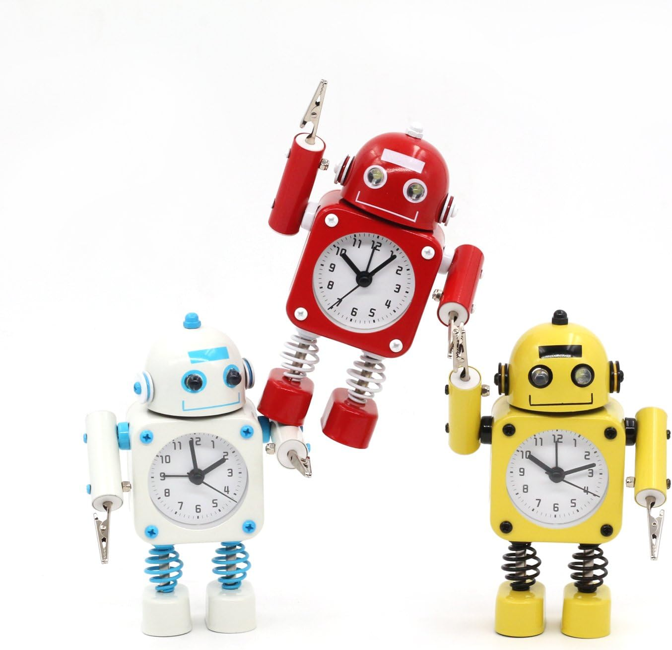 Drei Roboter-Uhren: rot schwebend, weiß stehend, gelb stehend. Weiß und Gelb mit Klammern.