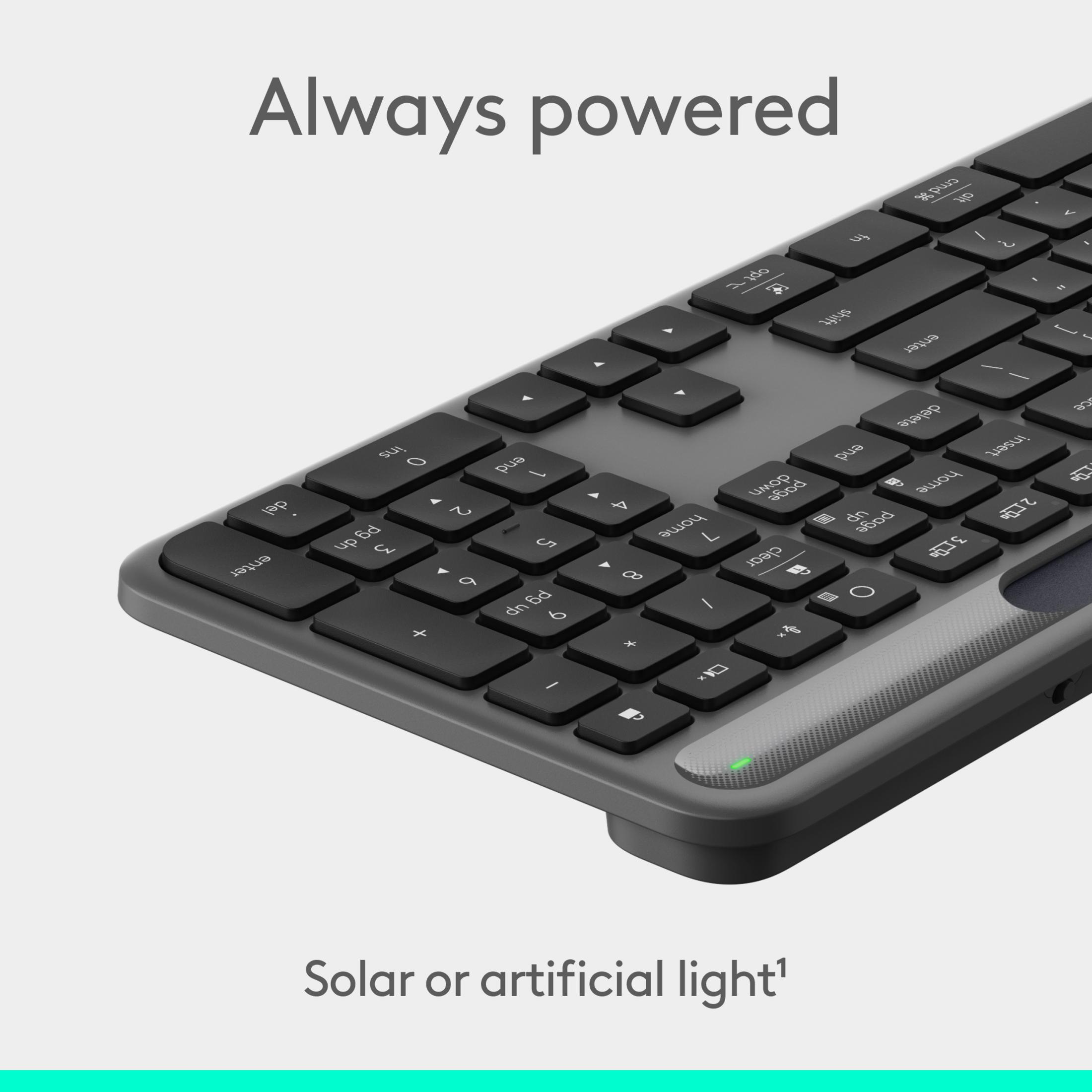 Eine graue Tastatur mit Solarpanelstreifen und einer grünen LED.
