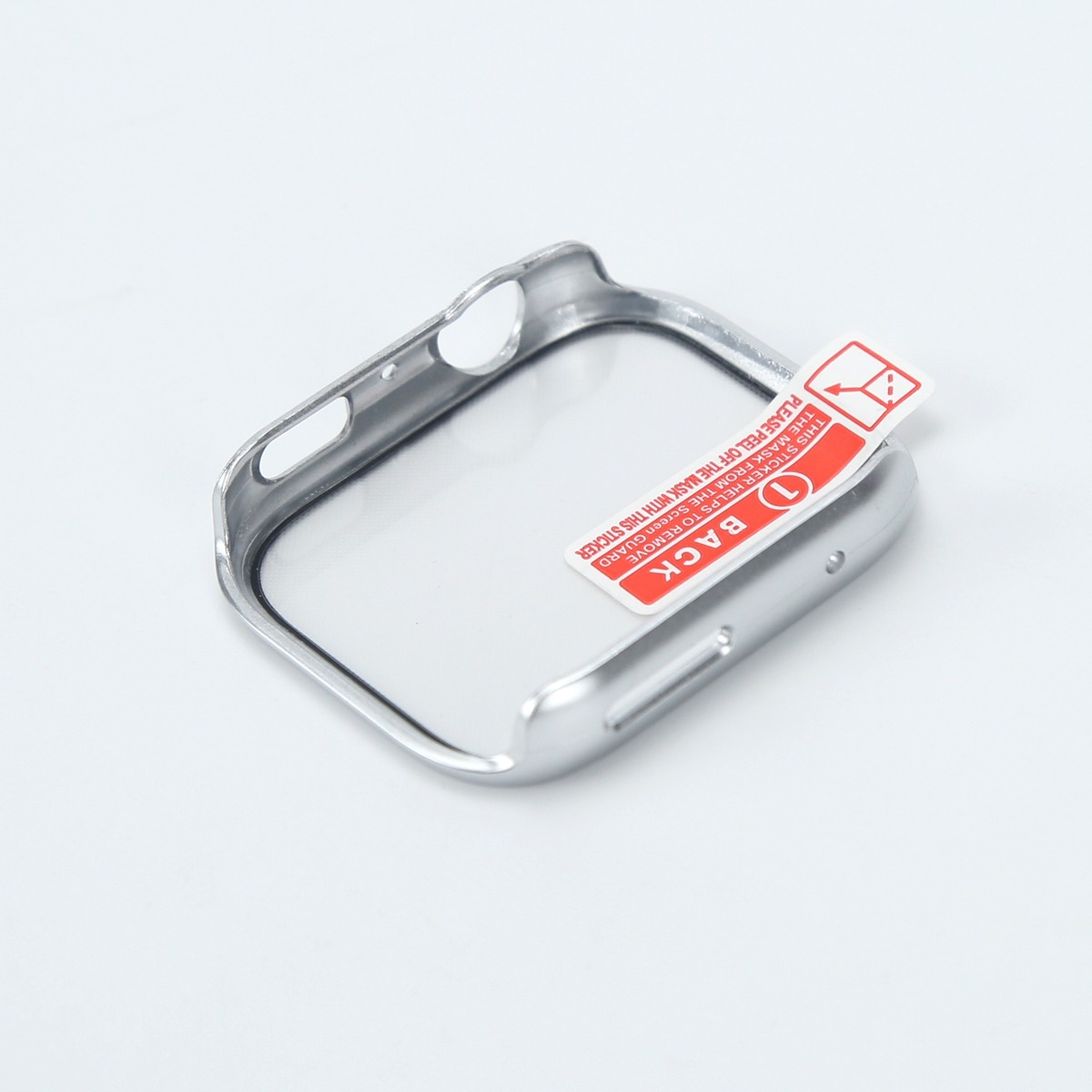 Protezione per orologio argentata con adesivo rosso 'BACK' su sfondo bianco.