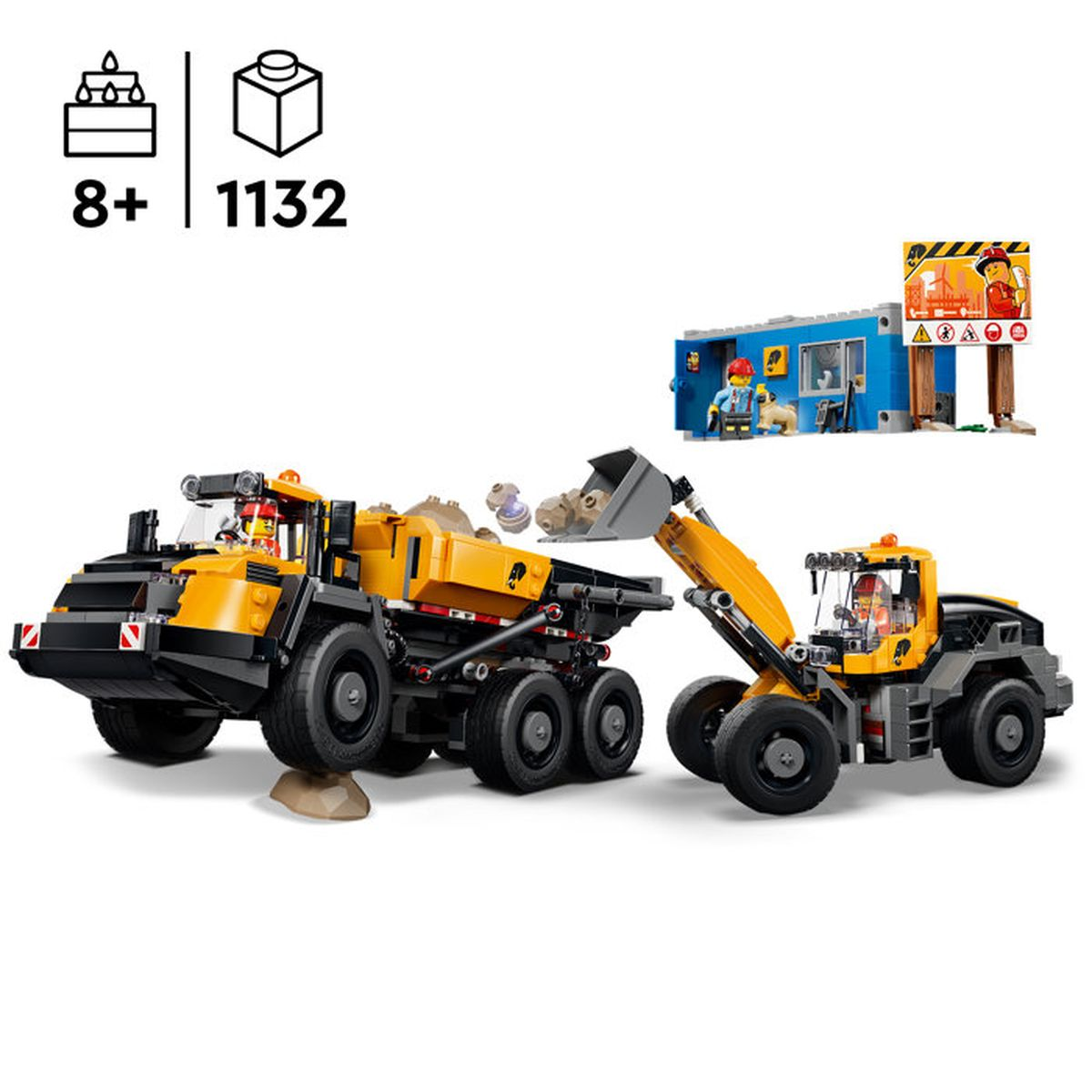 Giocattoli camion dumper e pala gommata gialli, con edificio blu e figure.