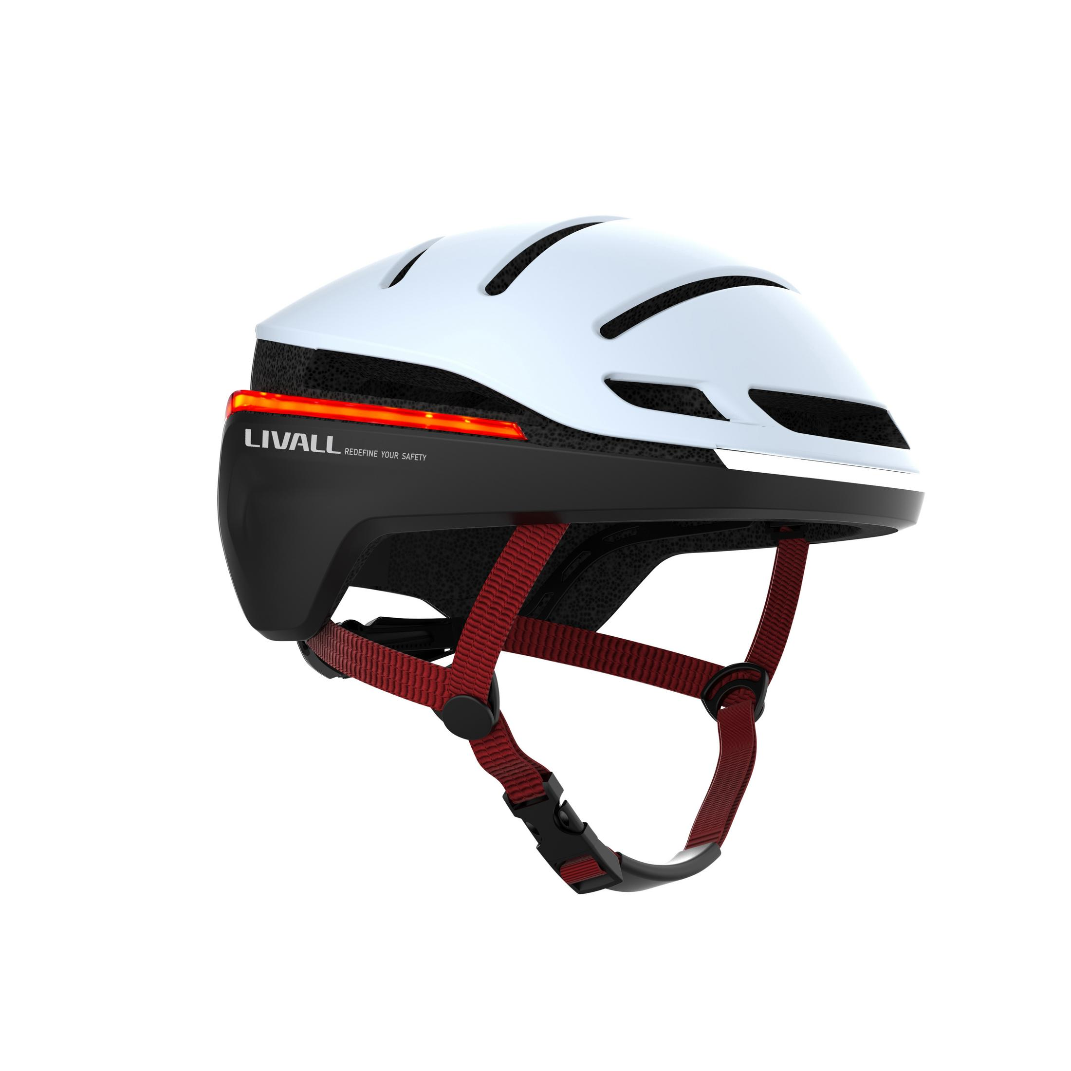 Casco da bicicletta bianco con prese d'aria nere, cinghie rosse e luci LED.