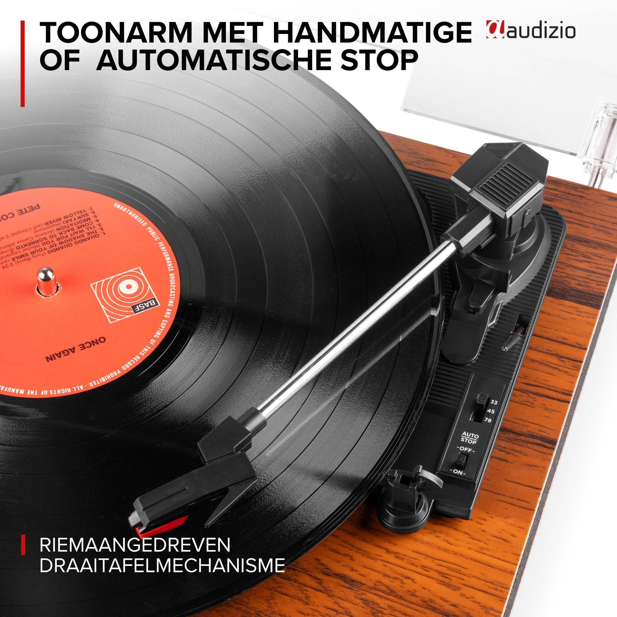 Record player with tonearm, needle, and black vinyl record with orange label.