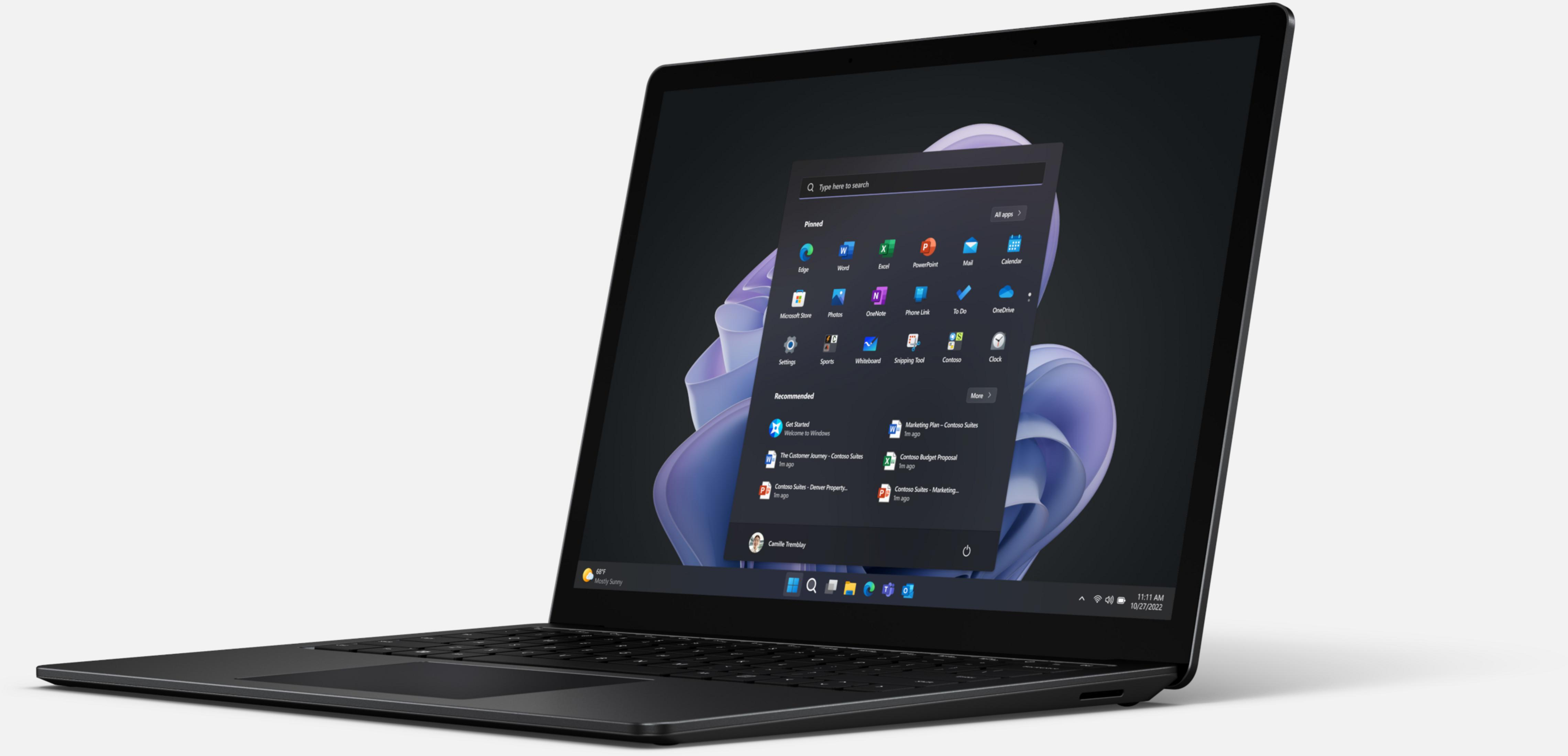 Ein schwarzer Laptop mit einem geöffneten Startmenü, das Apps und empfohlene Elemente anzeigt.