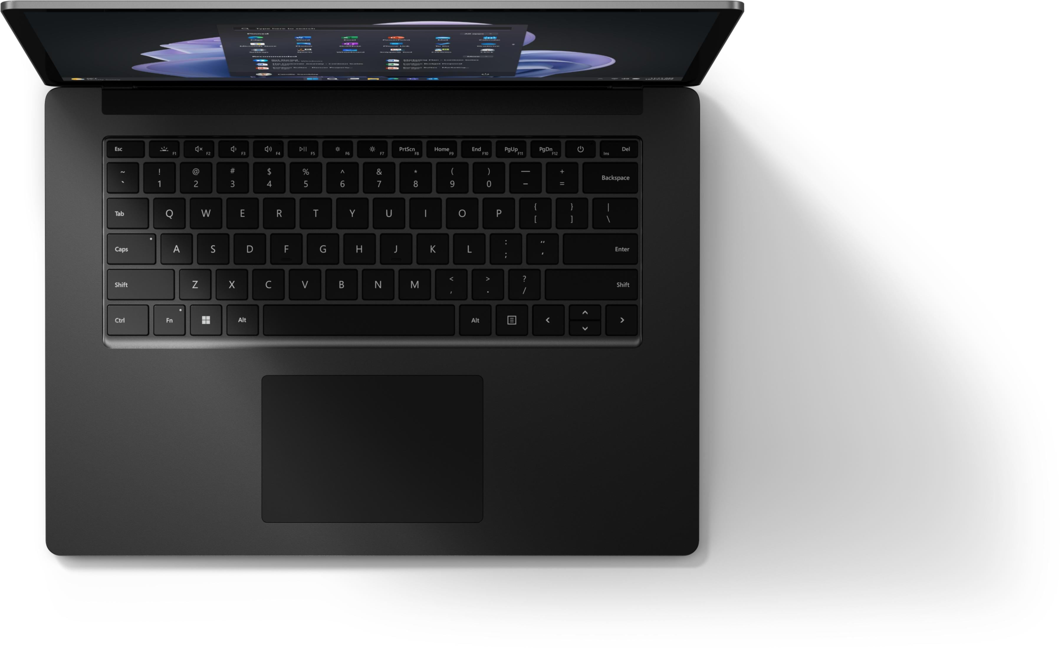Ein dunkler Laptop mit geöffnetem Bildschirm, der Apps anzeigt. Tastatur und Trackpad sind sichtbar.