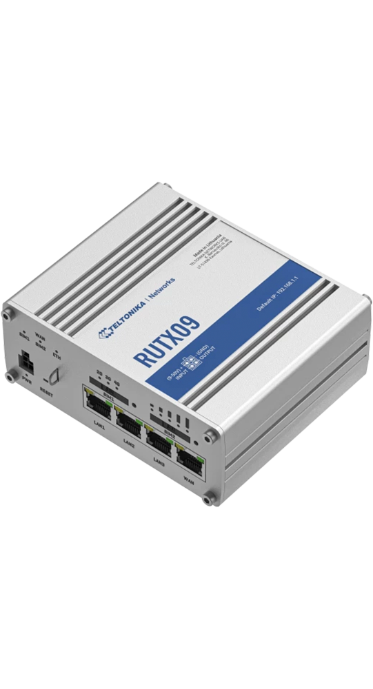 A silver Teltonika Networks RUTX09 router with ports and labels.