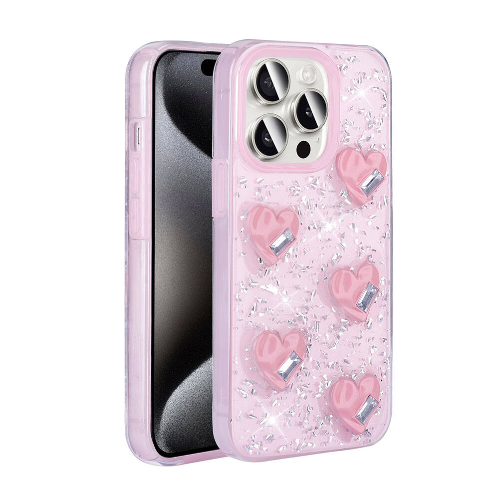 Simli ve kalp şeklinde taşlarla süslü pembe telefon kılıfı telefonda duruyor.