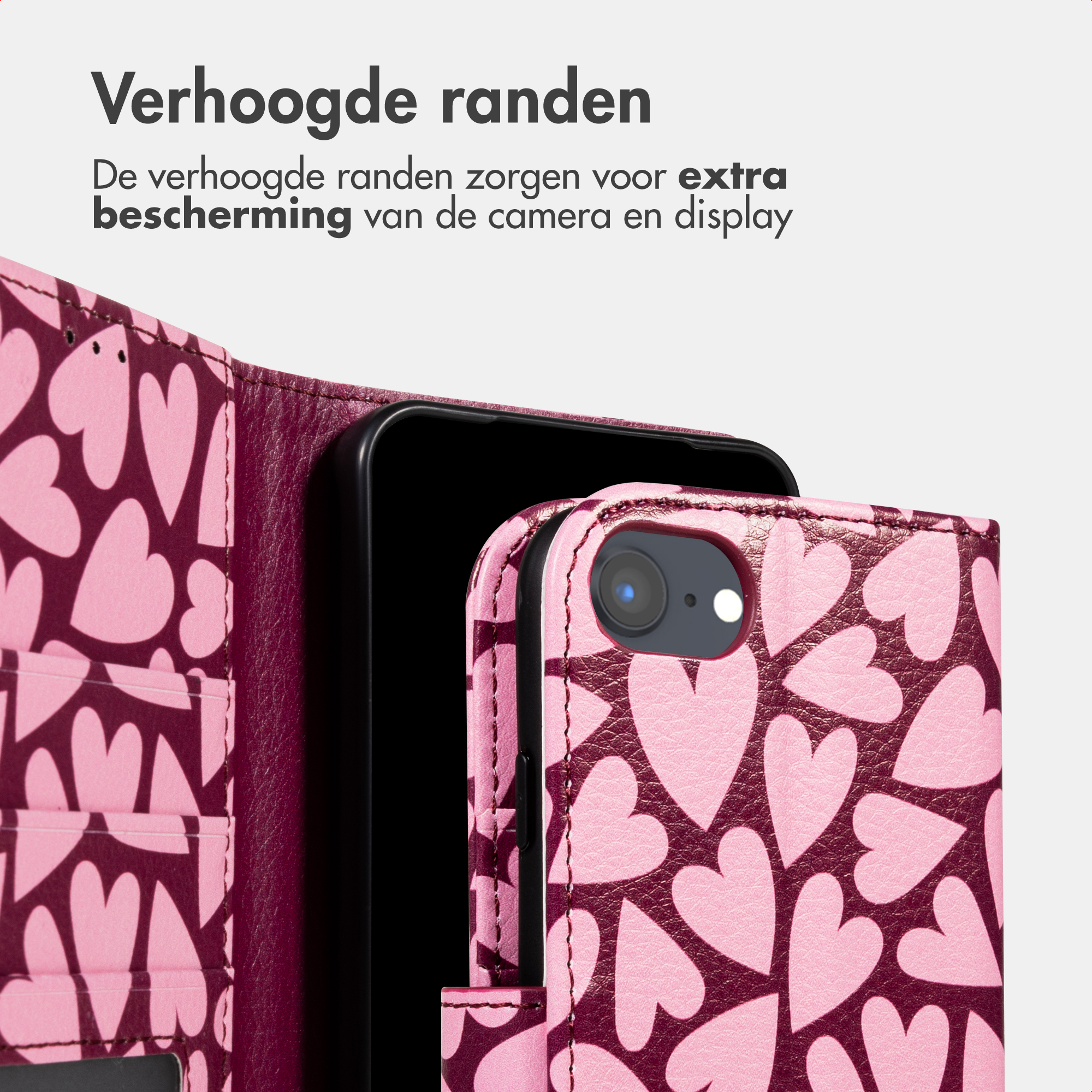 Una custodia per telefono rosa con cuori e un telefono nero.