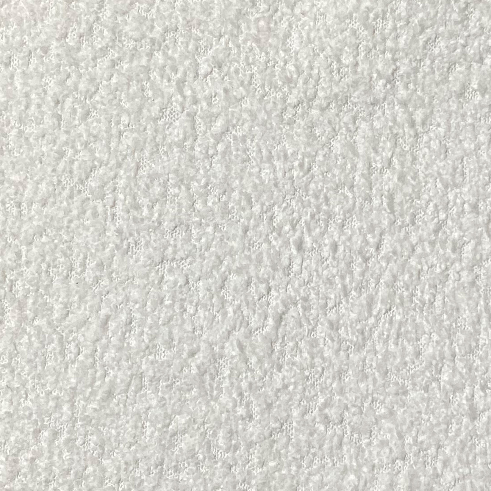 Tejido texturizado blanco con un patrón de pequeñas protuberancias.