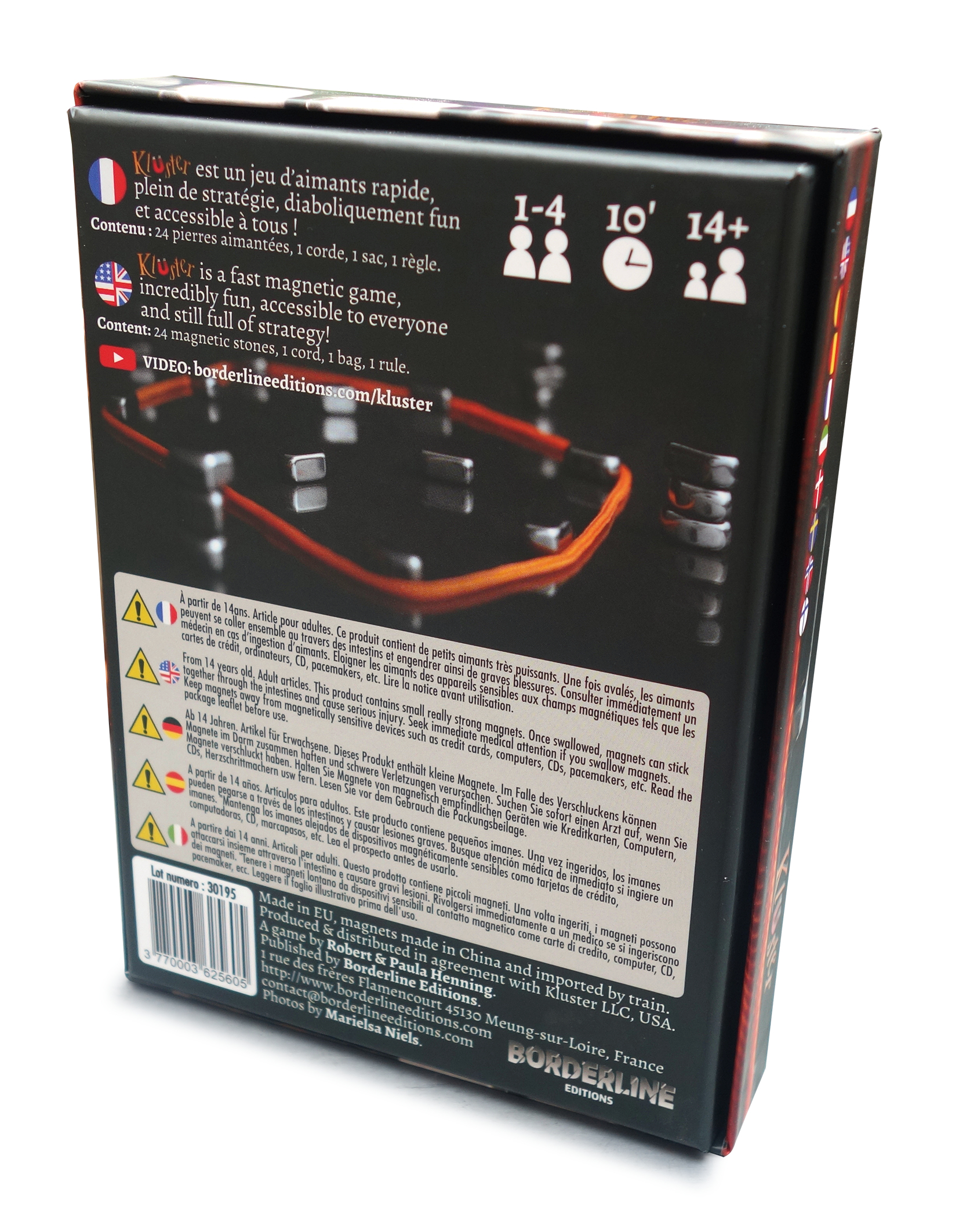 Caja del juego de mesa Kluster con imanes, cuerda, bolsa y reglas.