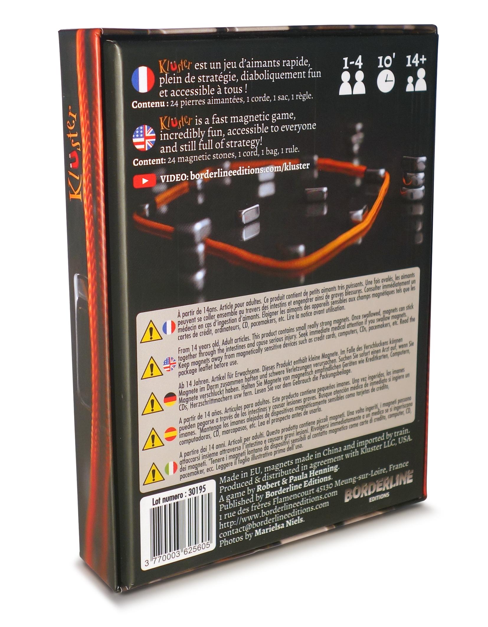 Caja del juego Kluster con advertencias e información del producto.