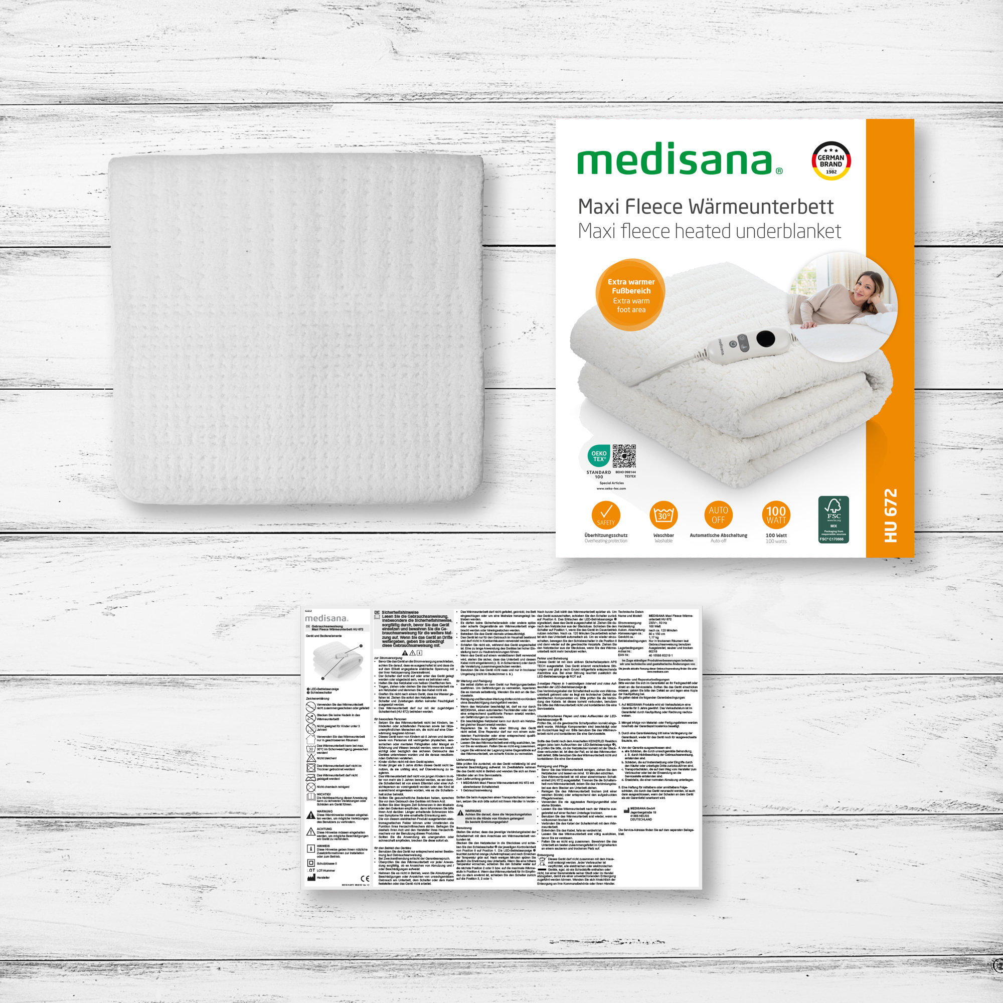 A white Medisana Maxi Fleece heated underblanket with controller.