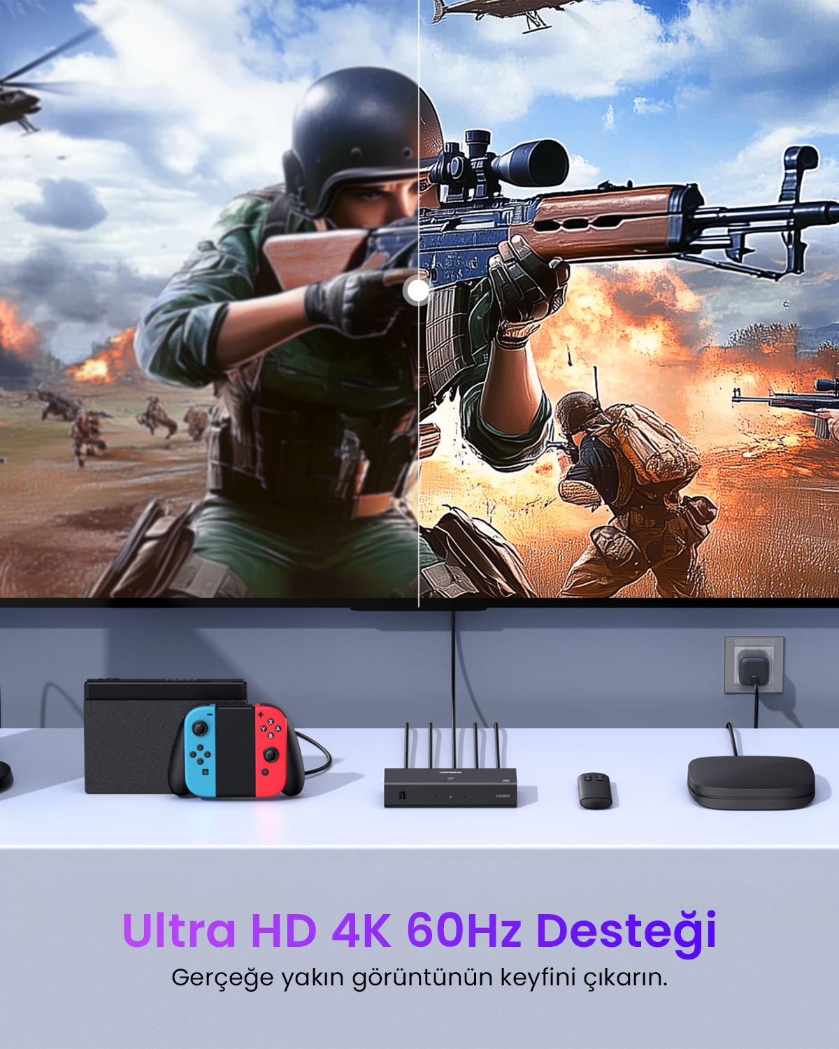 Uno schermo mostra un gioco con soldati ed elicotteri, sotto una console e accessori.