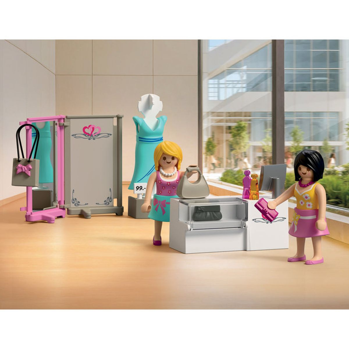 Dos figuras de Playmobil en una tienda con perchero, maniquí y mostrador de caja.
