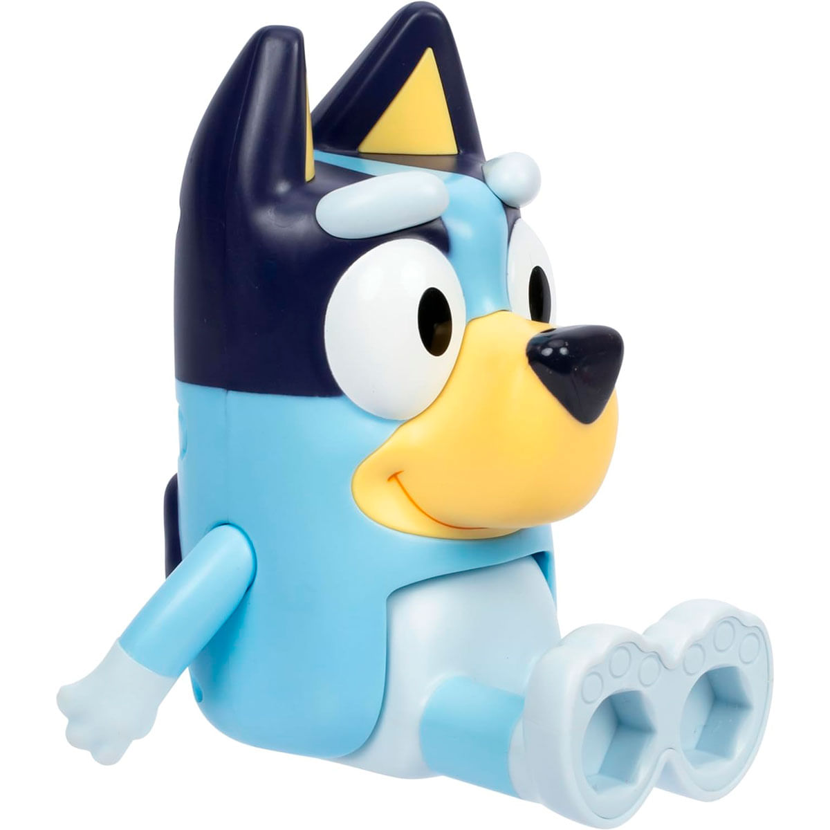 Figura de juguete de perro azul claro con ojos grandes y hocico amarillo sentado.