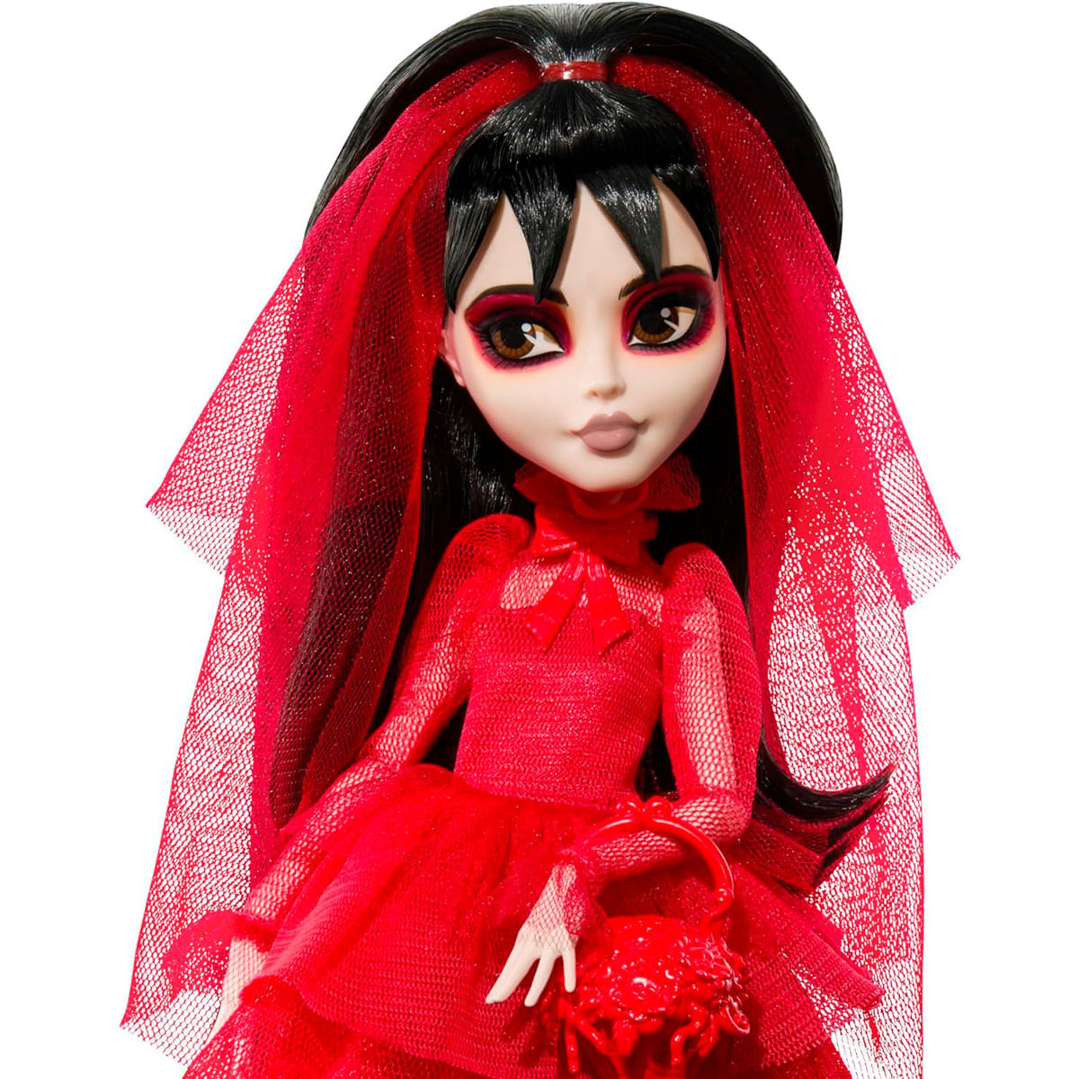 Una muñeca con pelo negro, vestido rojo y velo, sosteniendo una cesta roja.