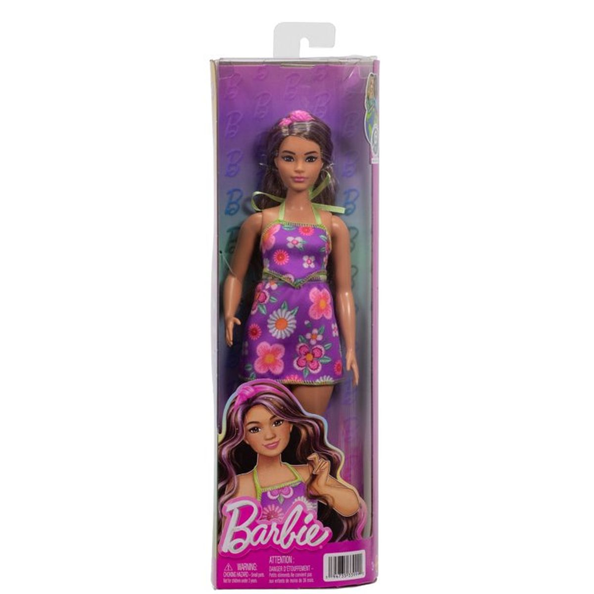 Muñeca Barbie con vestido morado floral en embalaje.