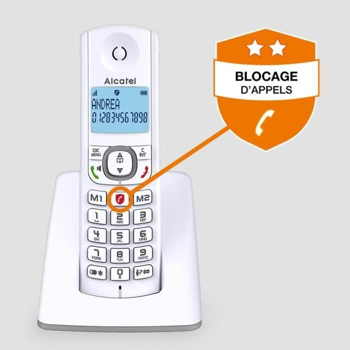 Un telefono cordless bianco con display e tastiera in una base di ricarica.