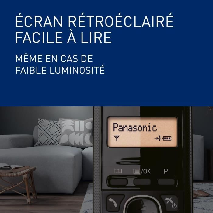 Un telefono Panasonic con display retroilluminato è su un tavolo accanto a un divano.