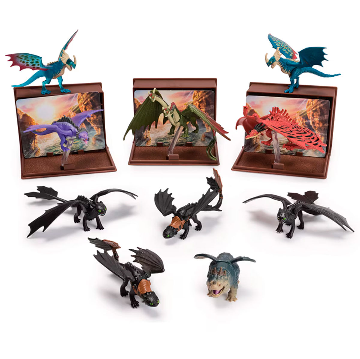 Colección de juguetes de dragón en varios colores, algunos en exhibición.