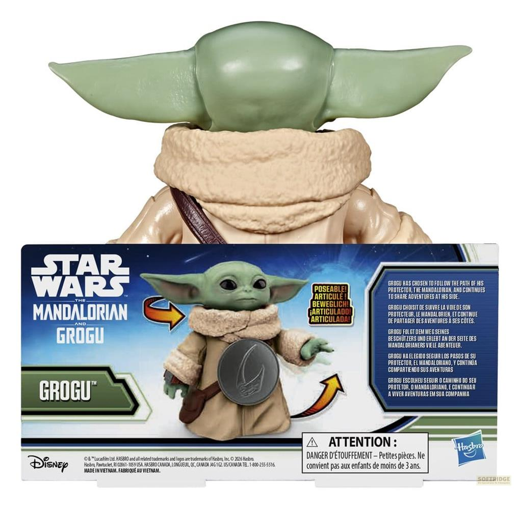 Figura de Grogu de Star Wars con orejas grandes y túnica marrón en embalaje.