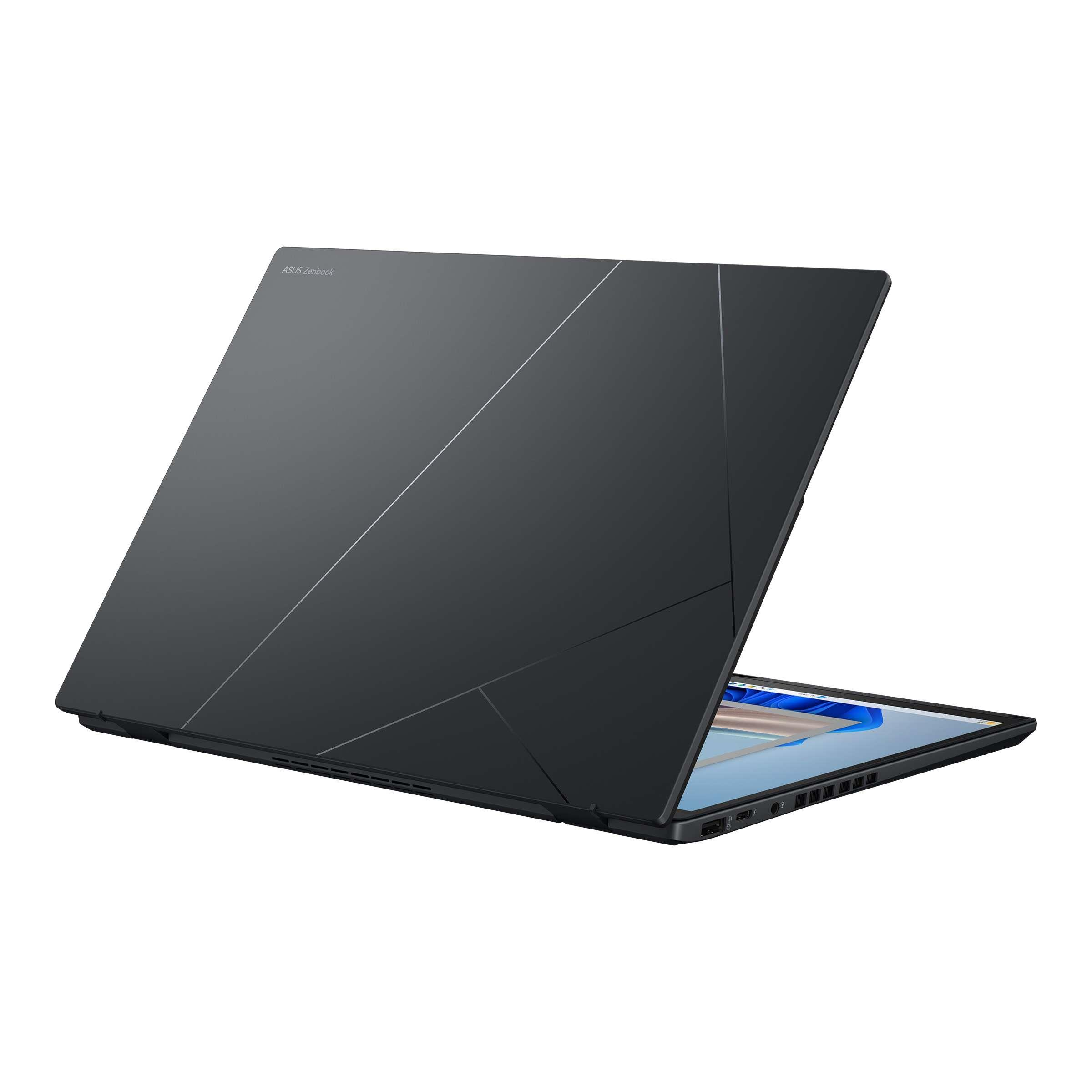 Koyu gri dizüstü bilgisayar, kısmen açık, ekran ve bağlantı noktaları görünüyor. ASUS Zenbook logosu.