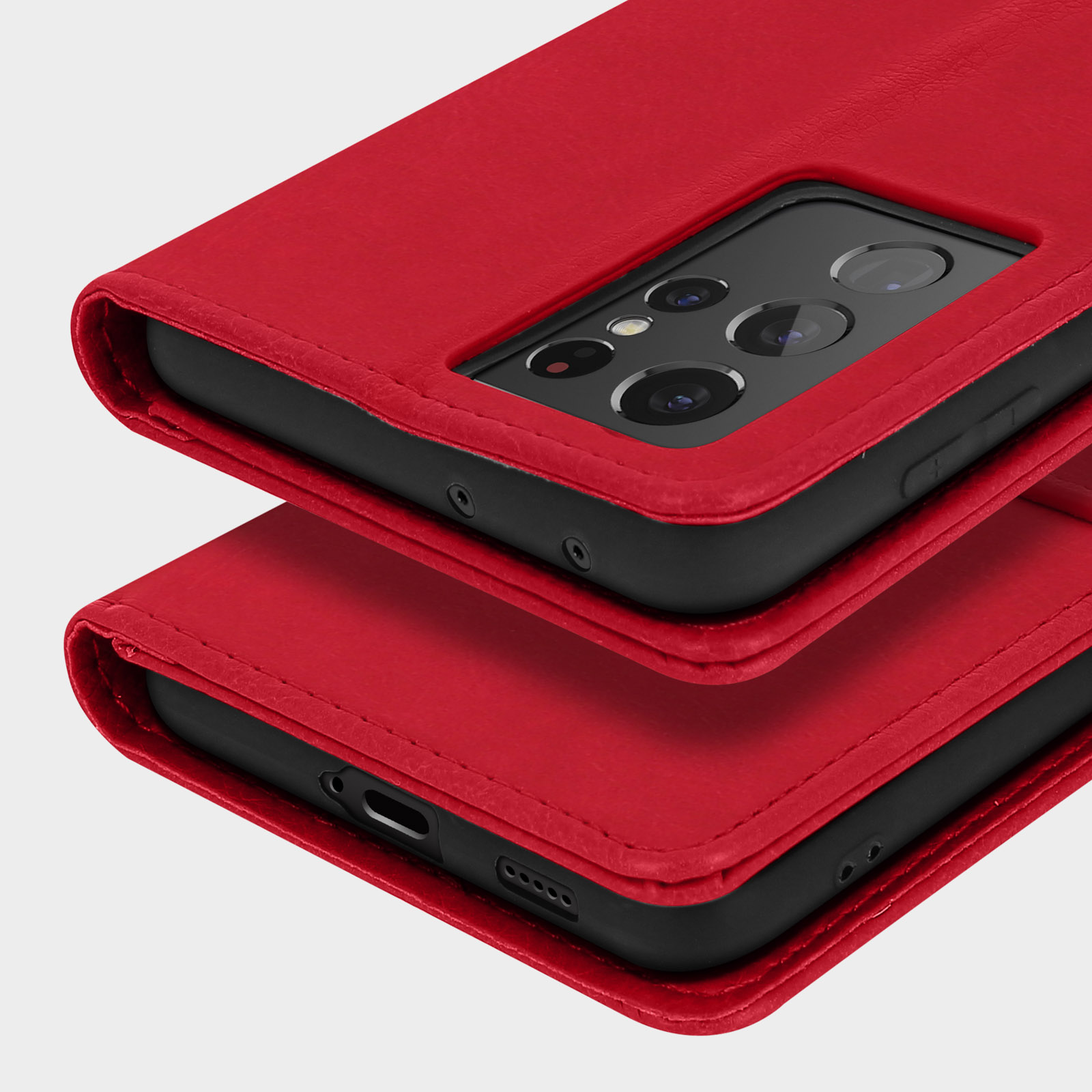 Una custodia per telefono in pelle rossa con ritaglio per fotocamera è impilata su un'altra identica.