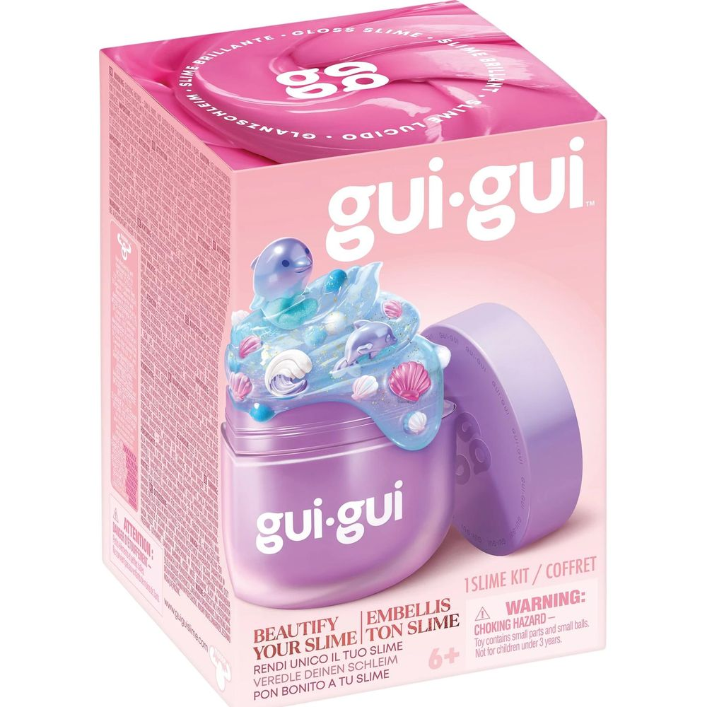 Un kit de slime Gui-Gui con slime brillante azul con delfines y conchas en un recipiente morado.