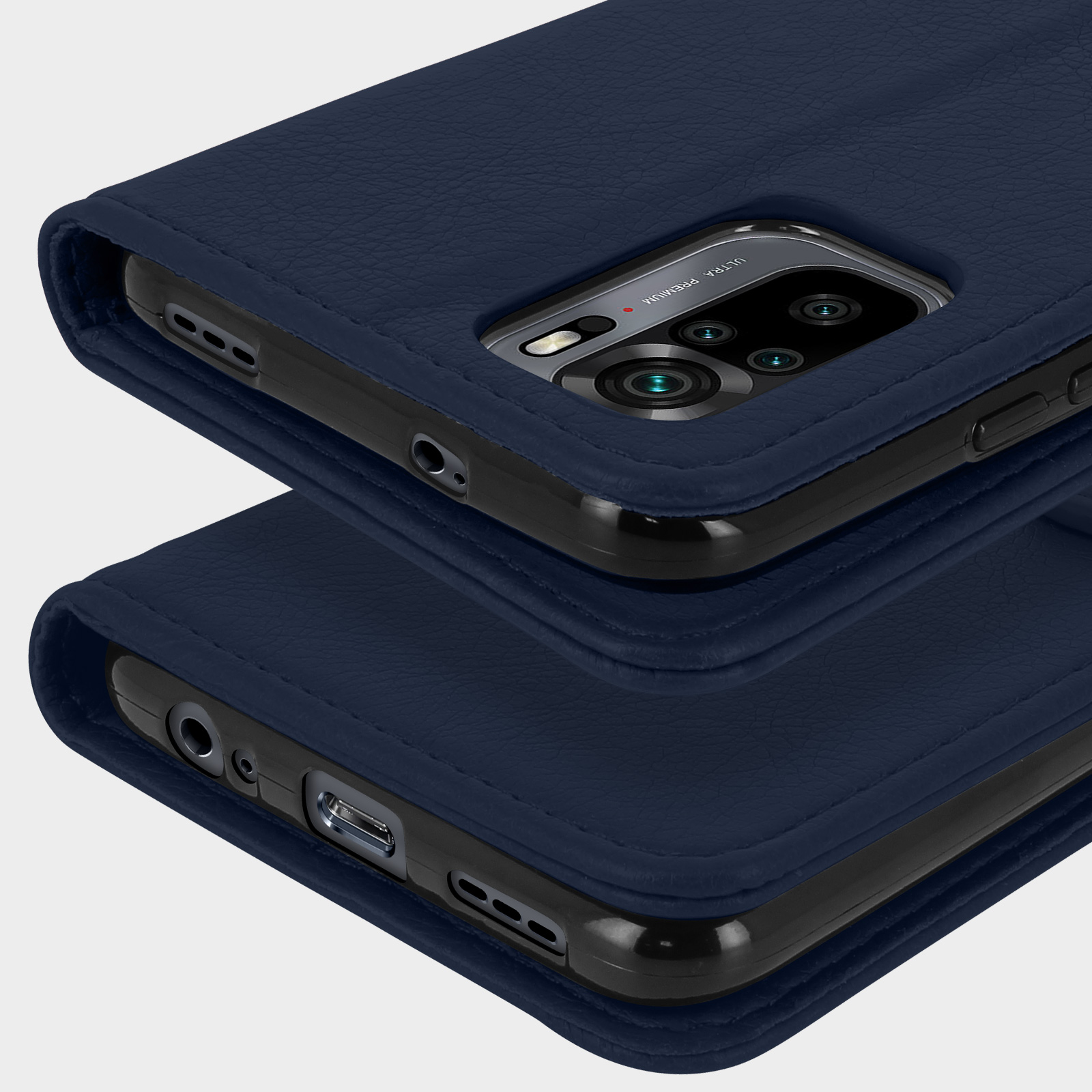 Primo piano di due custodie per telefono in pelle blu scuro impilate.