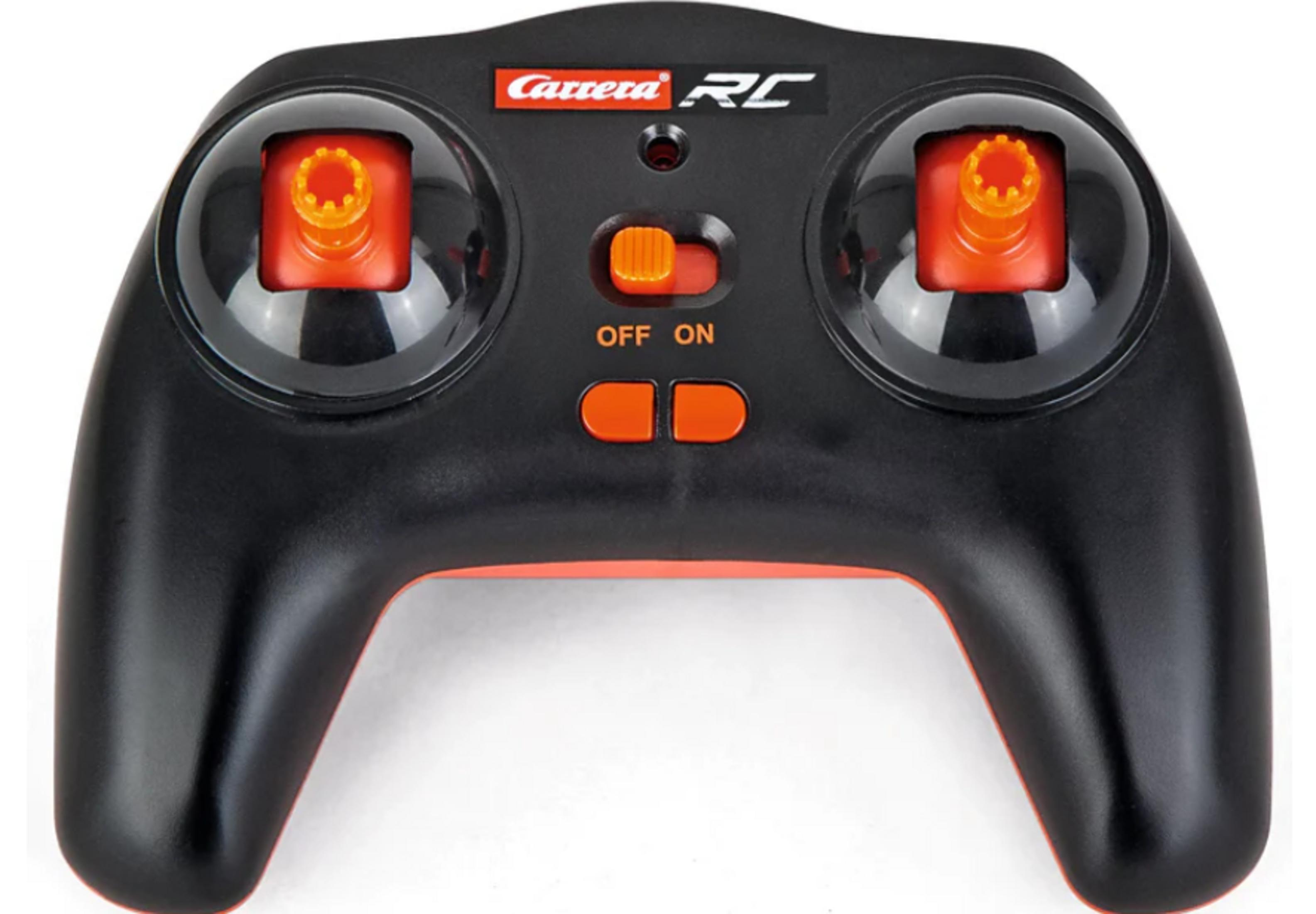 Controlador RC negro con joysticks, botones y detalles naranjas.