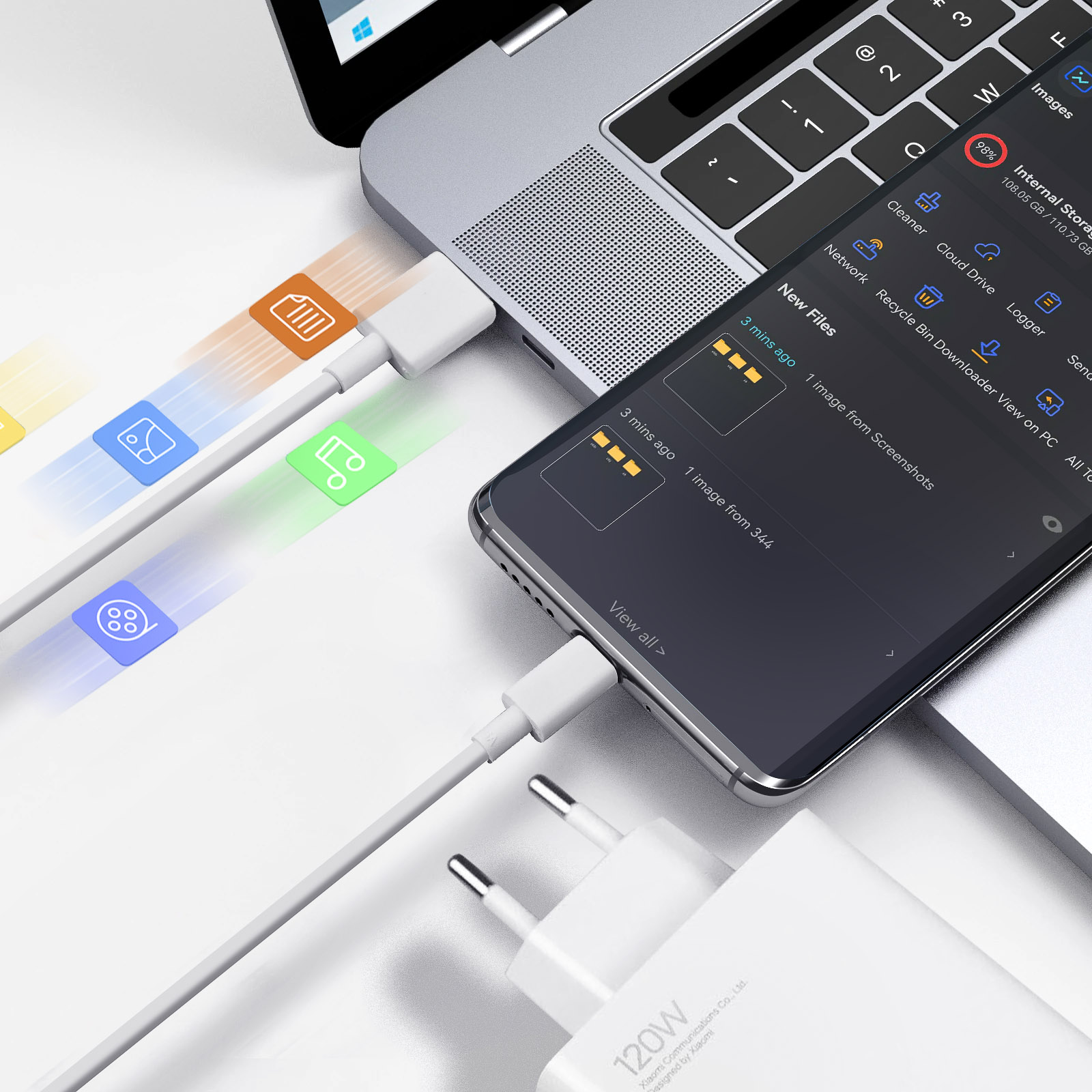 Un portátil, un smartphone y un cargador conectados. Iconos muestran transferencia de datos.
