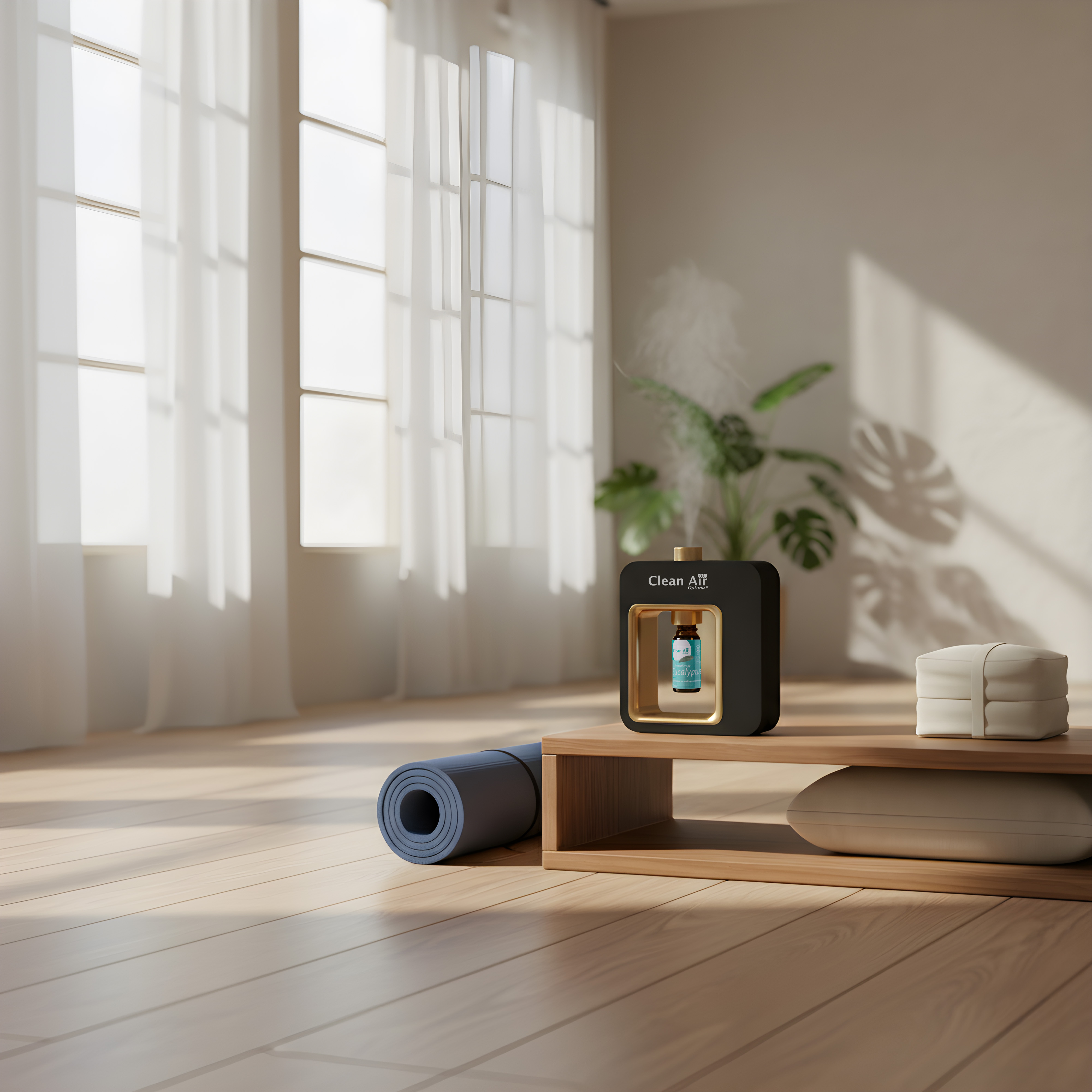 Een etherische olie diffuser, yogamat en kussens in een lichte kamer.