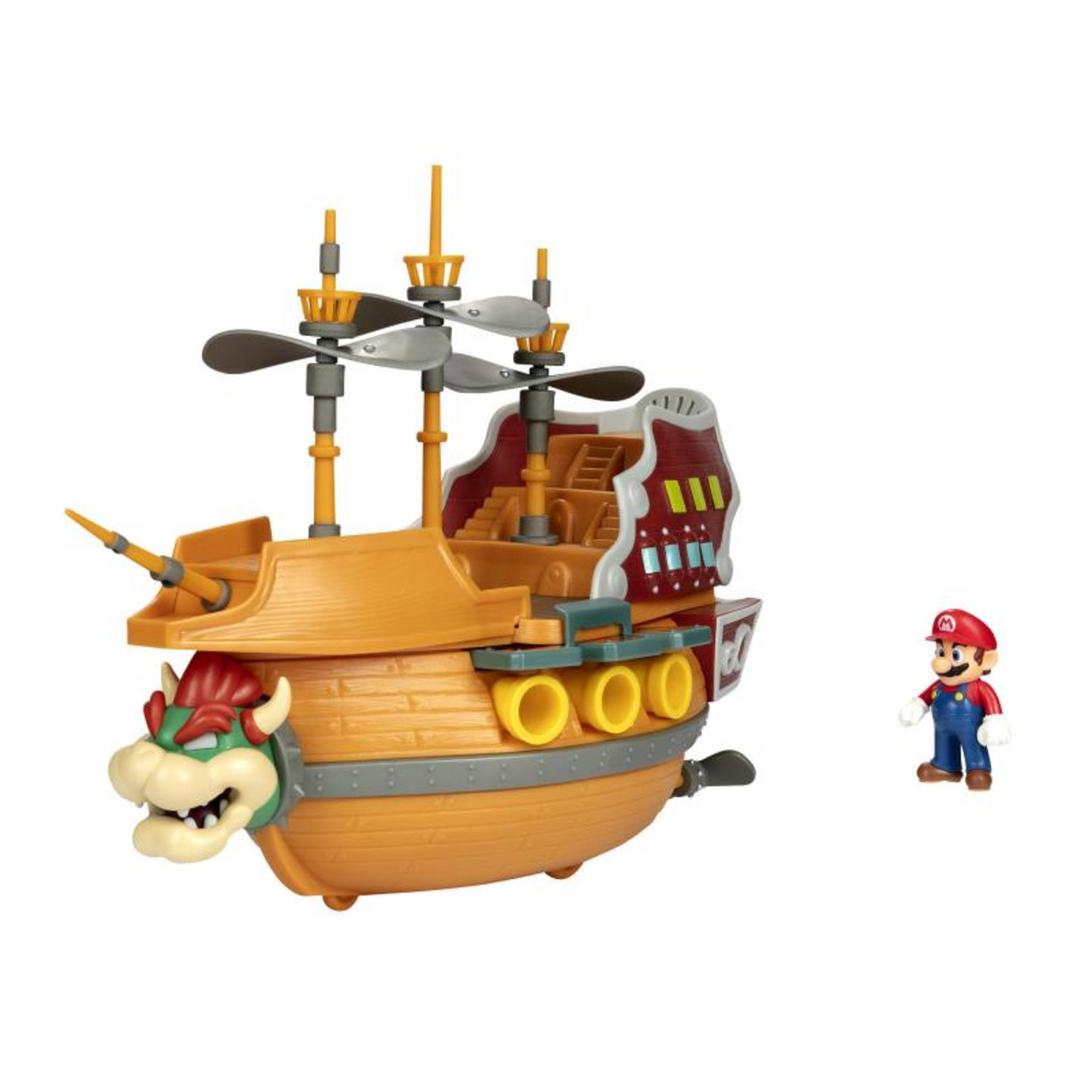 Una fortaleza de juguete naranja con la cara de Bowser y una pequeña figura de Mario.