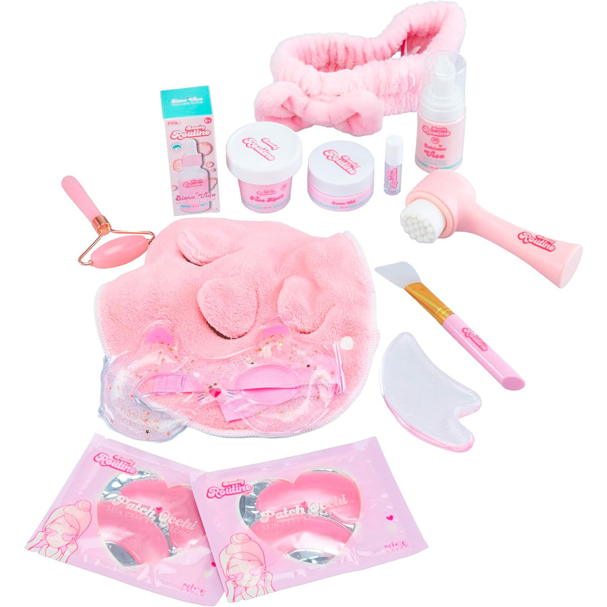 Set de cuidado de la piel rosa con rodillo facial, mascarilla, parches oculares, serum, cremas.