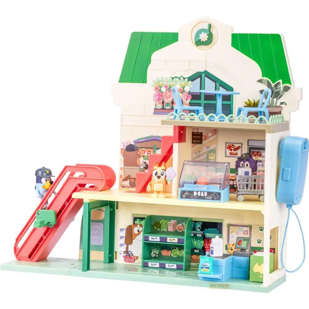 Supermercado de juguete con figuras, tobogán, carrito y caja.