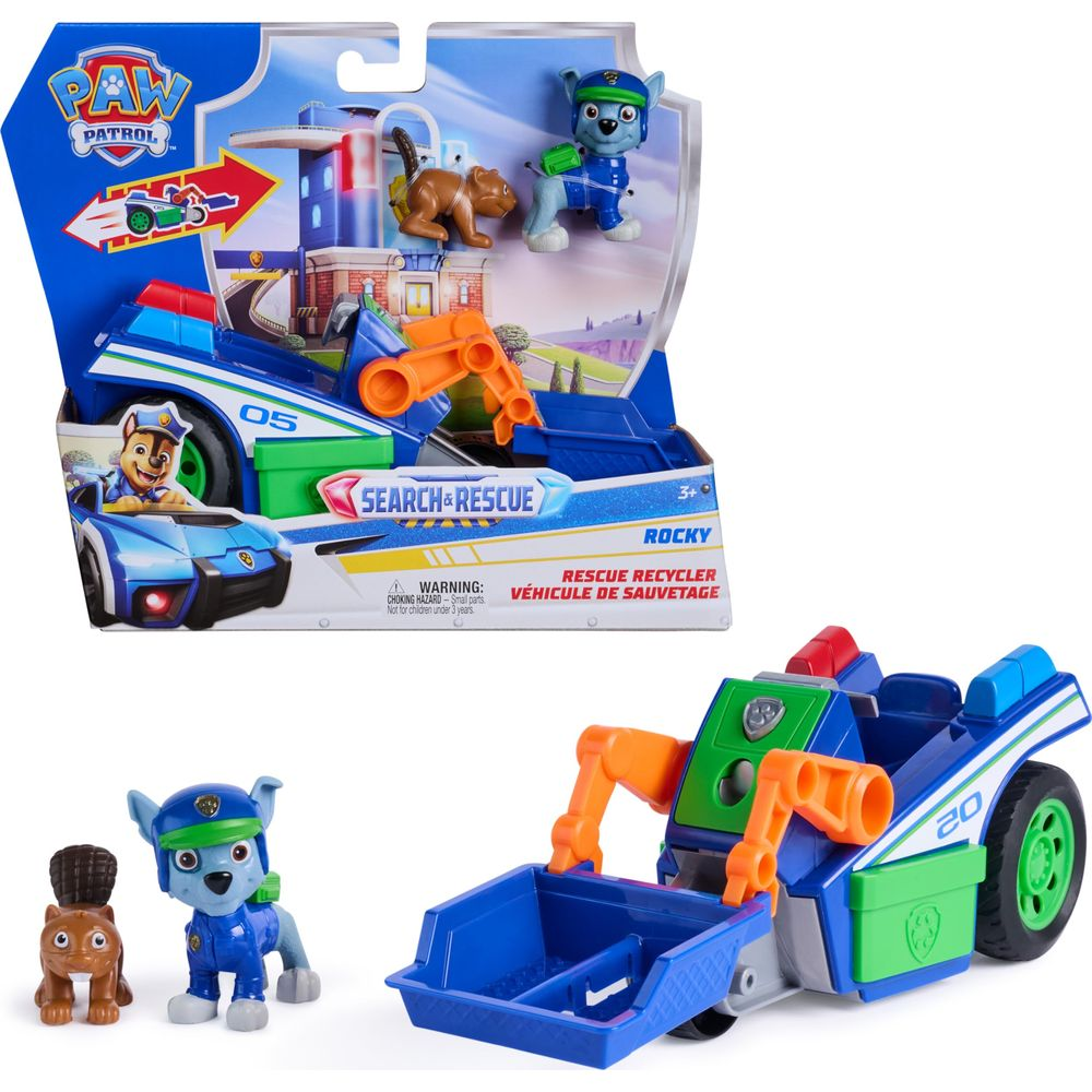 Juego de Paw Patrol con vehículo de Rocky y figuras de oso y perro en caja.