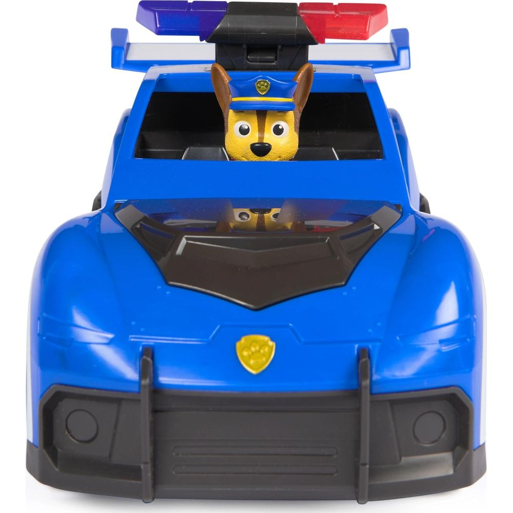 Un coche de policía de juguete azul con una figura de perro al volante y luces arriba.