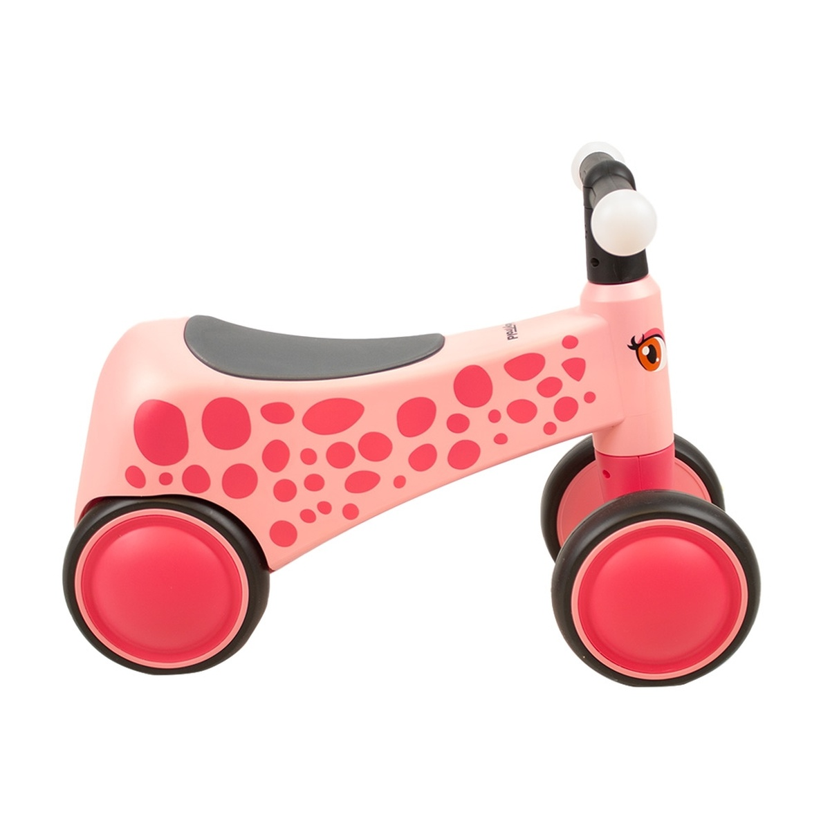 Ein rosafarbener Lauflernroller mit rosa Tupfen und schwarzen Rädern.