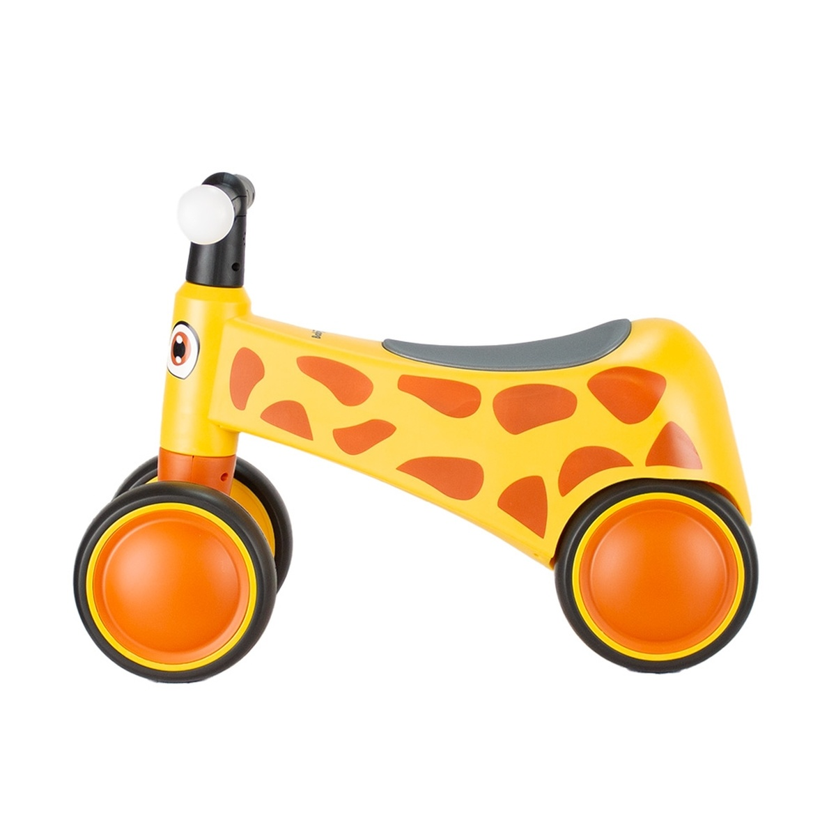 Ein gelbes Laufrad mit orangefarbenen Flecken, das wie eine Giraffe aussieht.