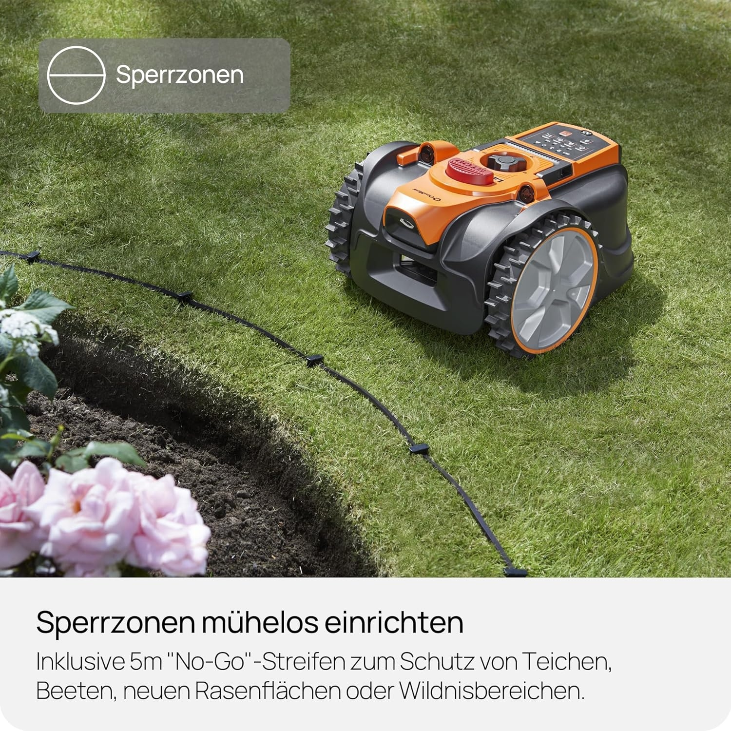 Ein Mähroboter auf einem Rasen mit Begrenzungskabel und Blumen.