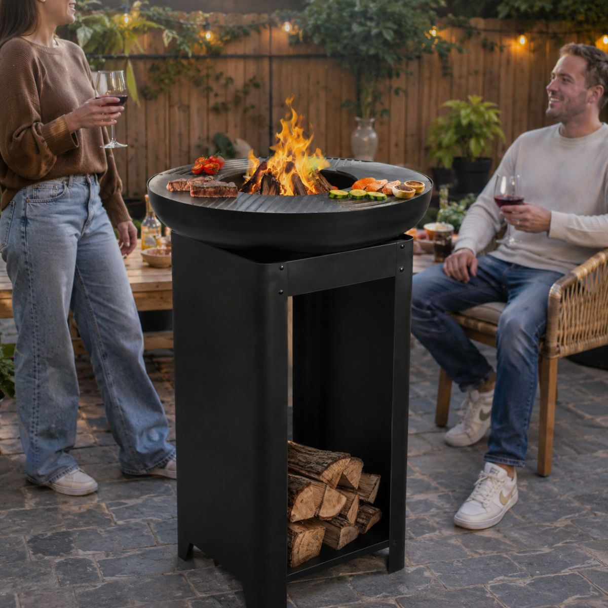 A couple grills outdoors, with logs stored in the grill.