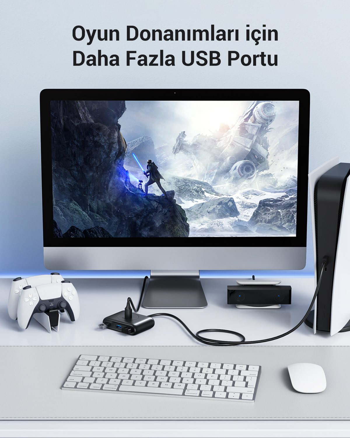 Monitörlü, klavyeli, fareli, oyun konsolu ve USB hub'lı bir masa.