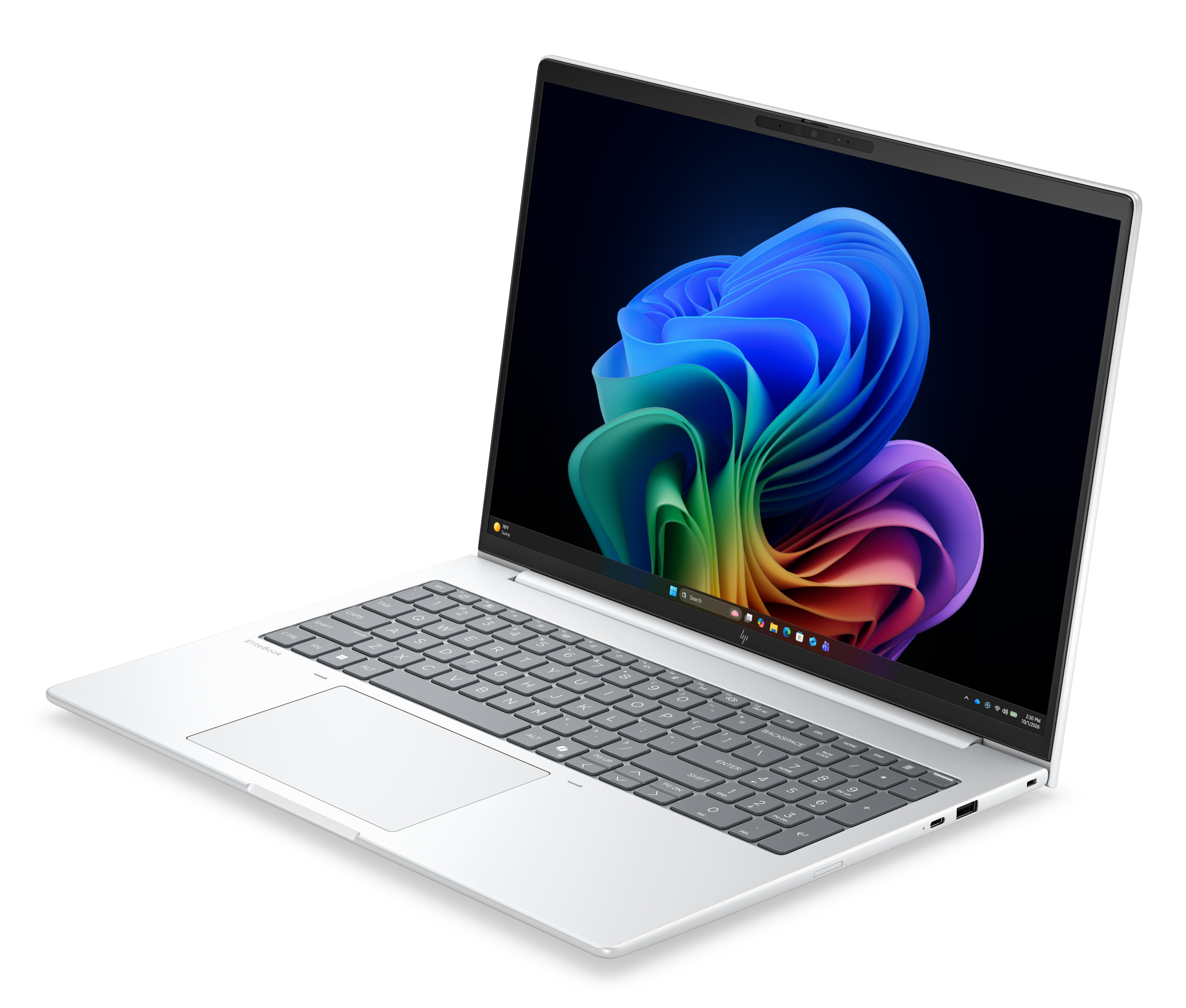 Un laptop argentato con tastiera e uno sfondo colorato sullo schermo.
