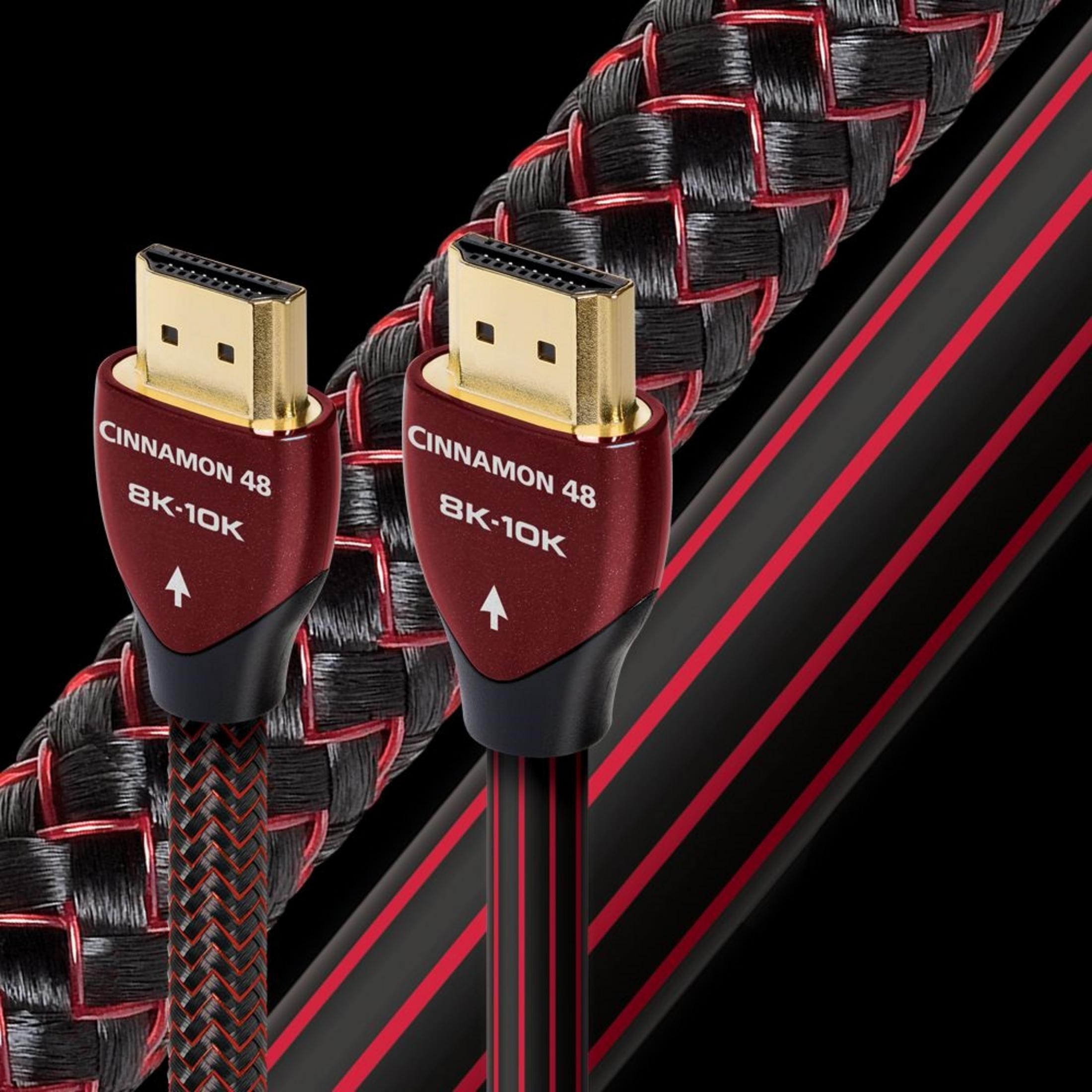 Siyah arka plan üzerinde kırmızı ve siyah konektör kasalı iki HDMI kablosu.