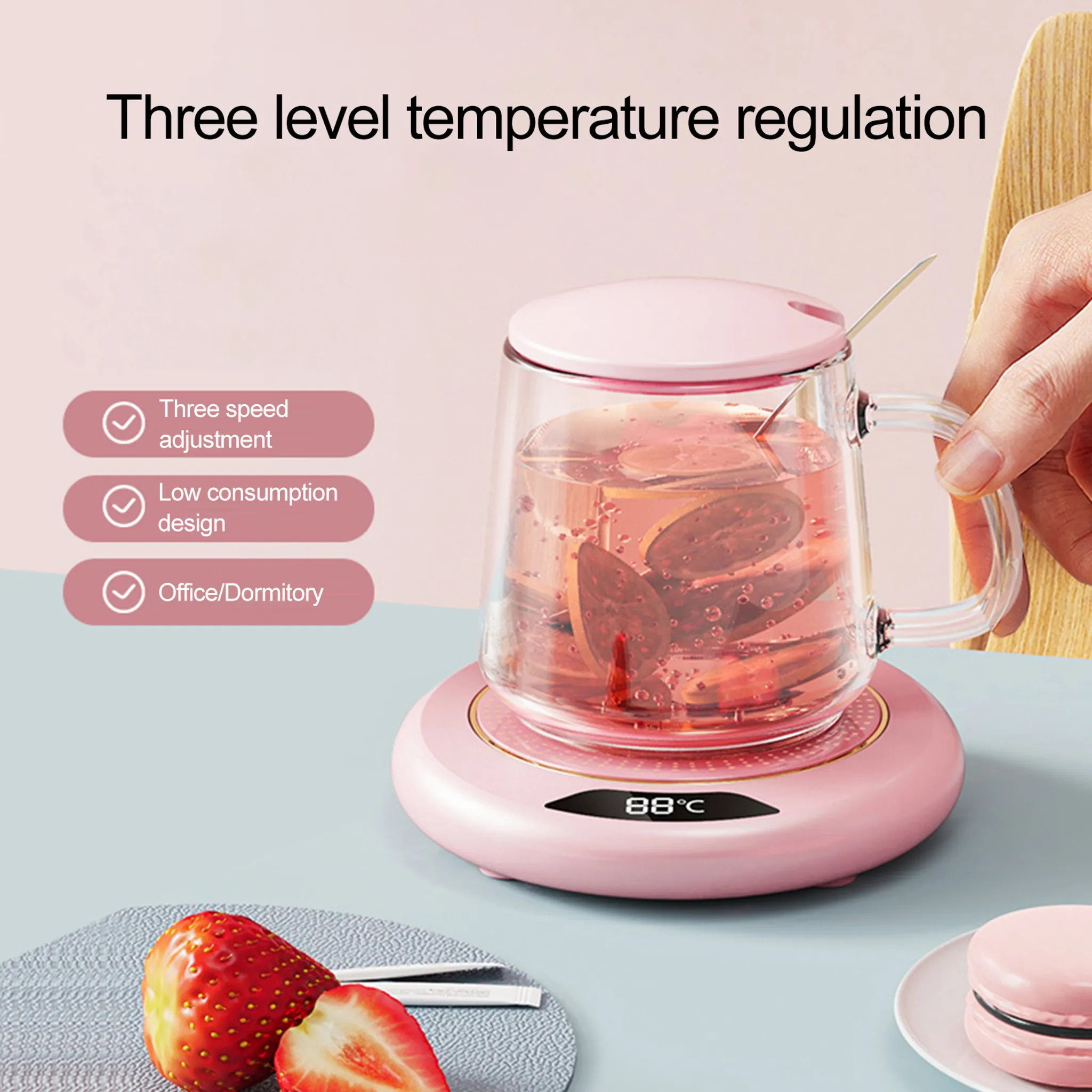 Eine Glas-Tasse mit pinkem Deckel steht auf einer pinken Heizplatte mit 88°C.